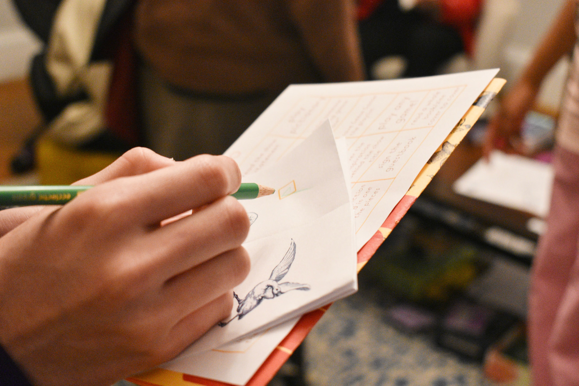 Upon arrival, attendees were given a pencil, a bingo card, and a zine with a goose scavenger hunt - photo by Jamie Potter