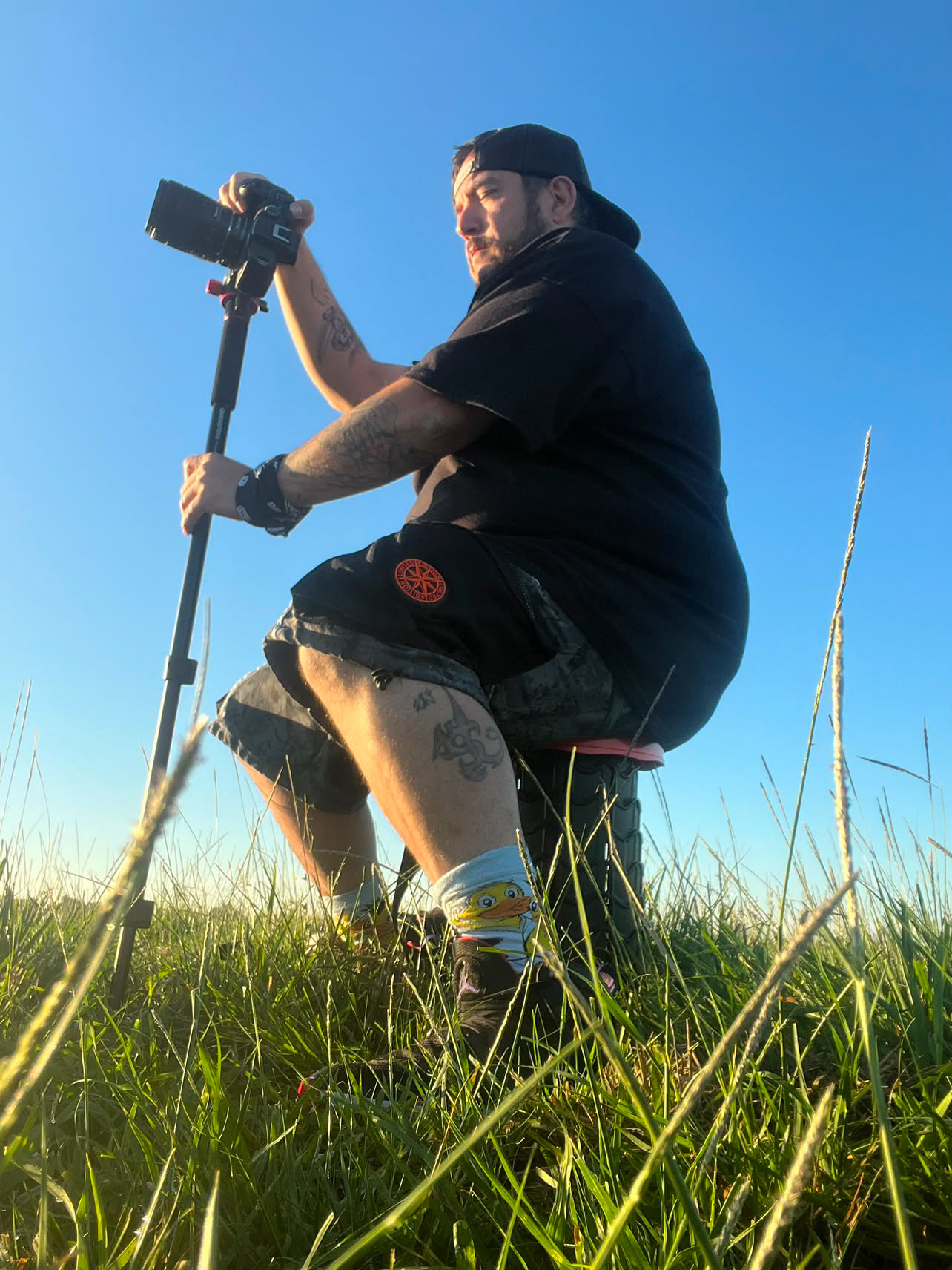 Jose Rodriguez photographing an event with a camera and monopo