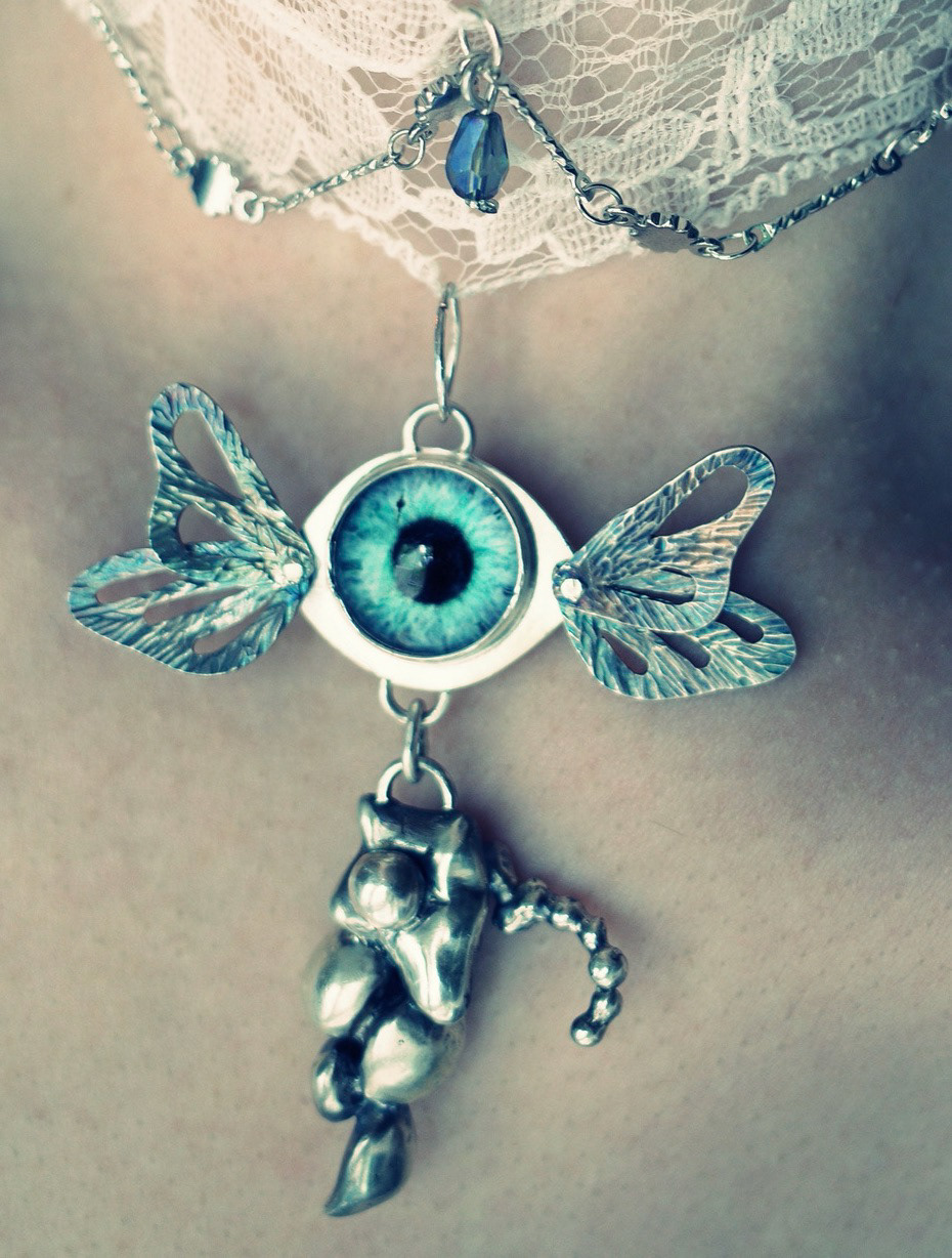 "lovely decay" - sterling silver, glass eye - july 2023