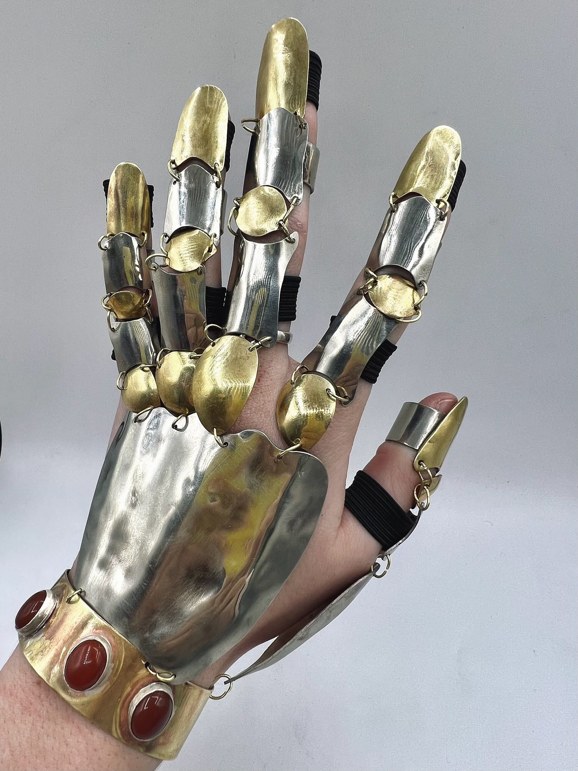 "gauntlet" - nickel silver, brass, elastic, carnelian stones - november 2022