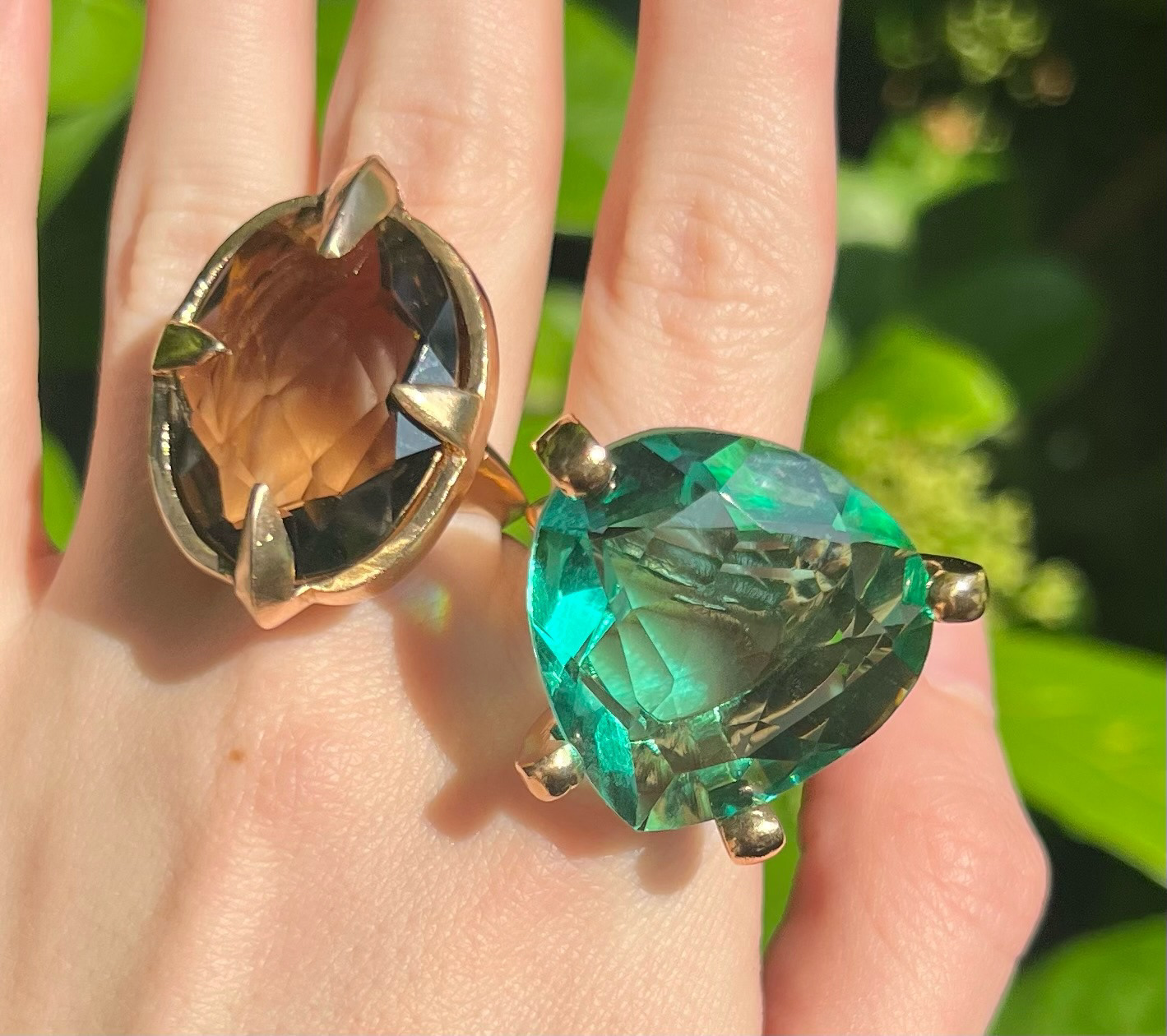 the glam rings: (left) hand carved in wax, cast in ancient bronze, paired with a smoky glass stone (right) hand carved in wax, casted in ancient bronze, paired with an emerald glass stone