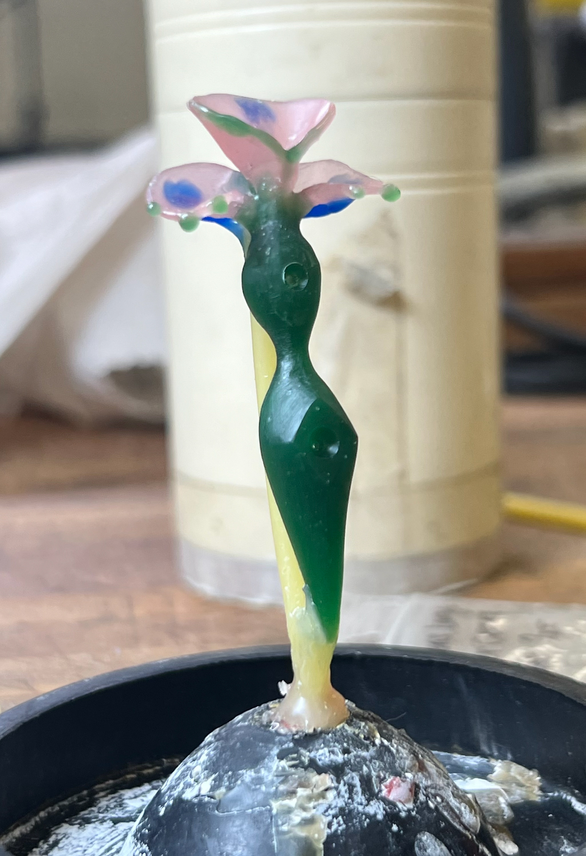 hand carved and molded wax, spruced for casting