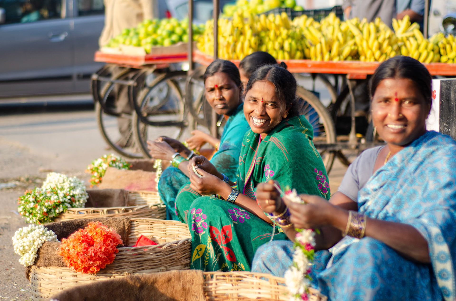 Flower vendors outside a wholesale flower market
