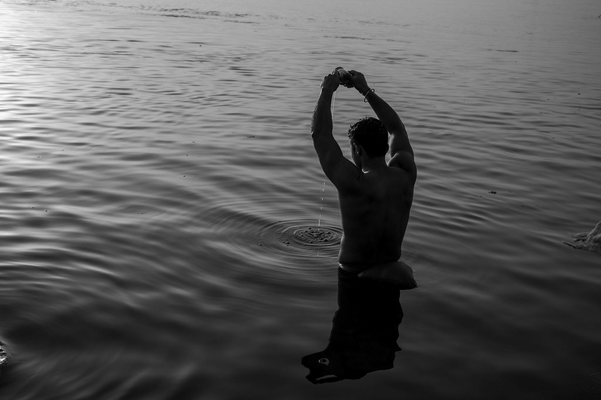 A local taking a dip in River Ganga in Varanasi