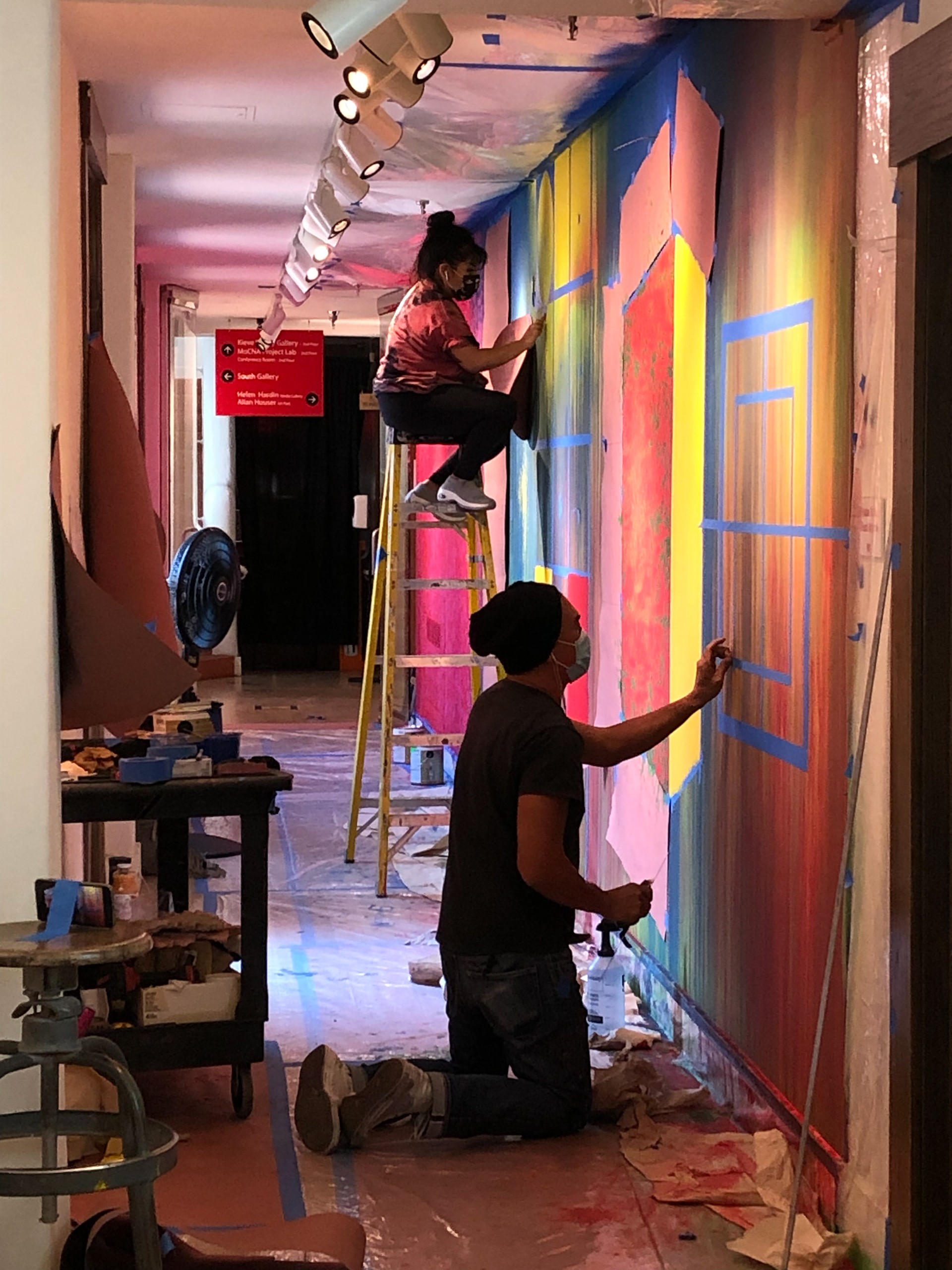 Installation of mural. Alexander Lee, Robyn Tsinnajinnie.
