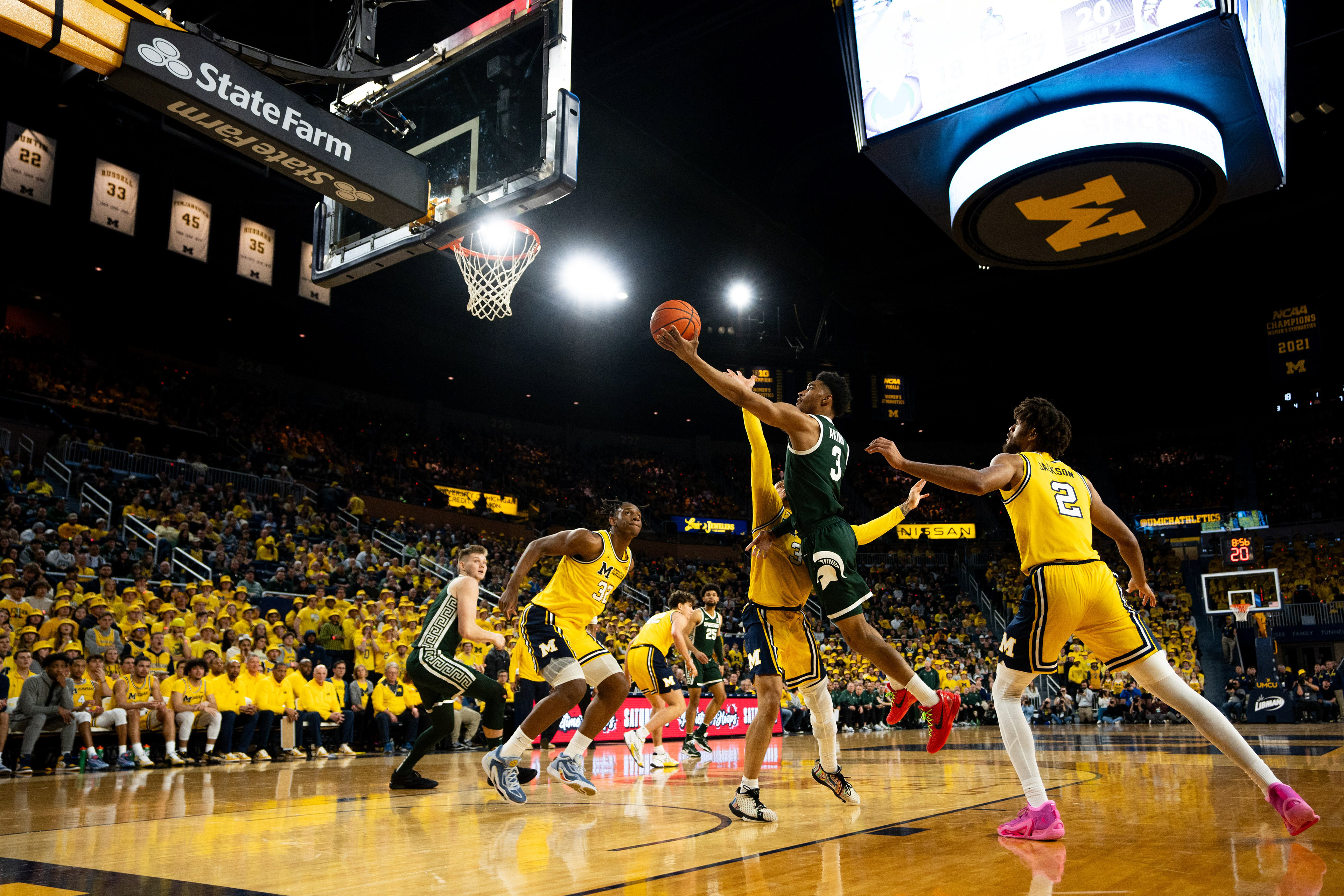 Michigan State junior guard No. 3 Jaden Akins shoots the ball at the Crisler center in Ann Arbor, Feb. 17, 2024. Michigan State secured their first win in Ann Arbor since 2019.