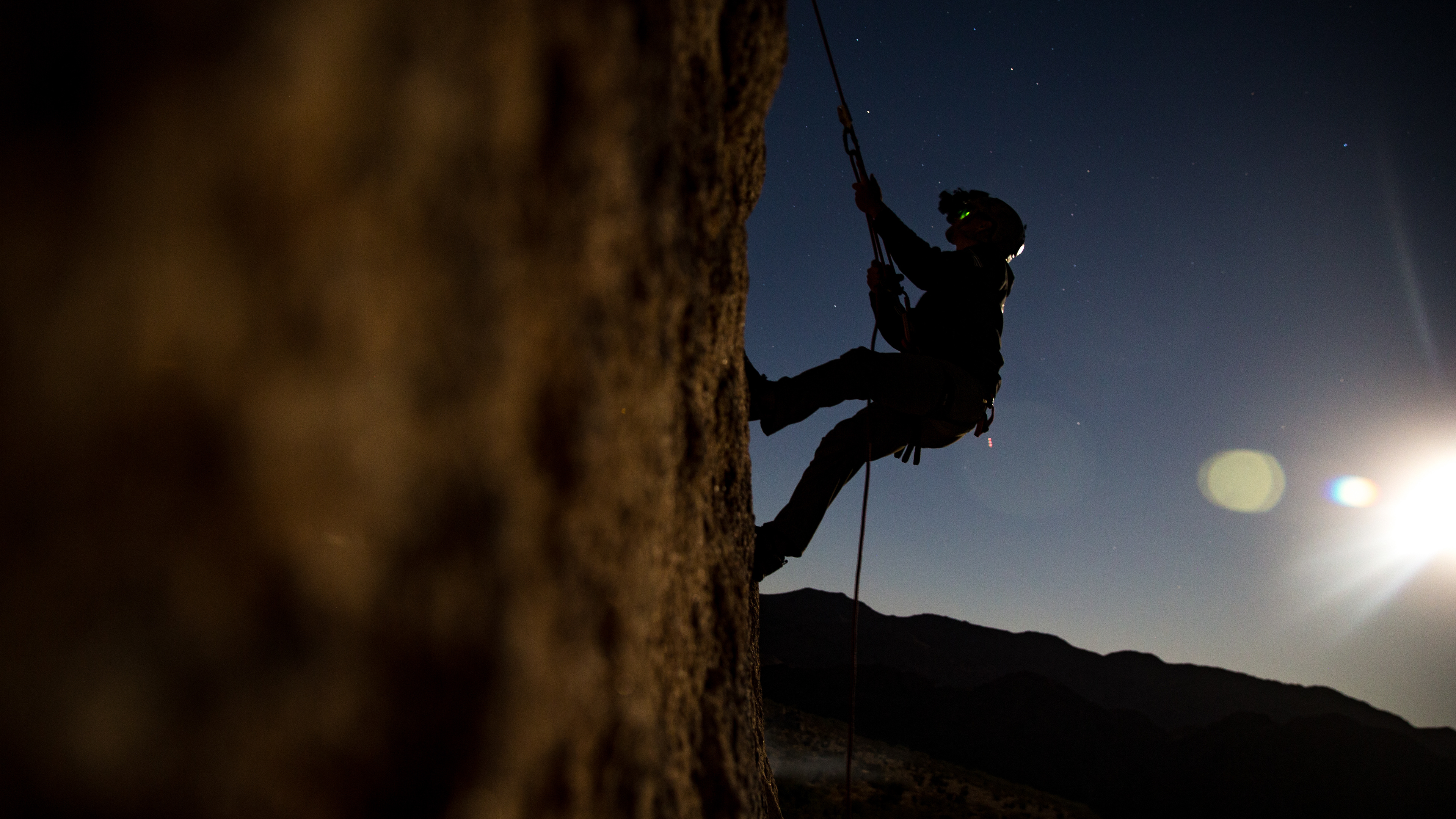 U.S. Marine Corps Sgt. Antonio Rojas Jr., an instructor with Expeditionary Operations Training Group, I Marine Expeditionary Force, ascends a rock formation during a night climb for an assault climber’s course at Joshua Tree National Park, California, Oct. 12, 2019. Assault climbers enable a unit to operate in environments that require the ability to climb and rappel, allowing Marine Corps units to move freely through terrain that would otherwise be impassable.
