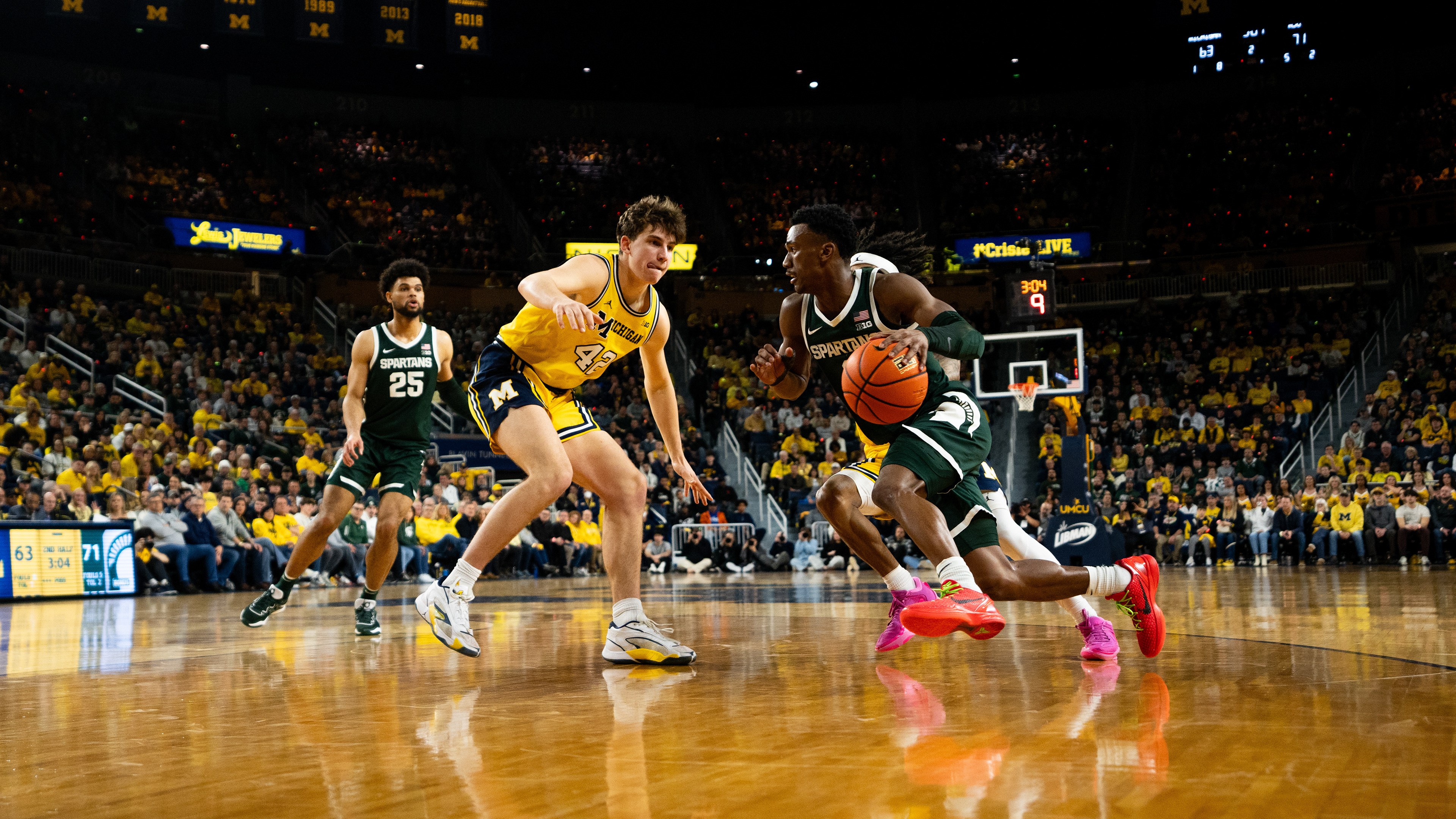 Michigan State graduate guard No. 2 Tyson Walker drives the net at the Crisler center in Ann Arbor, Feb. 17, 2024. Michigan State secured their first win in Ann Arbor since 2019.