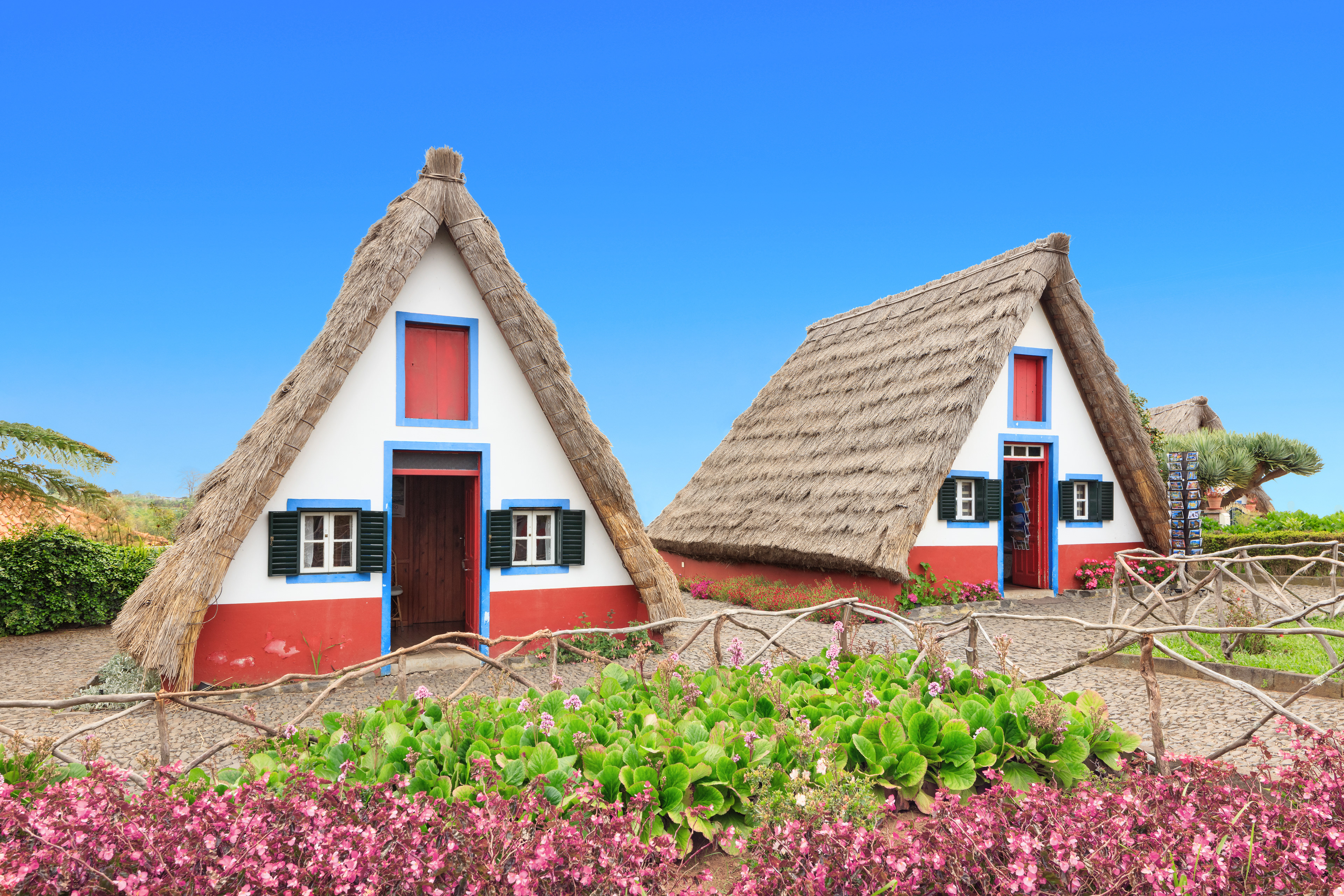 Traditional A-frame houses in Santana, Madeira island, Portugal | Licensed istock precedence photograph credited to Lena Serditova