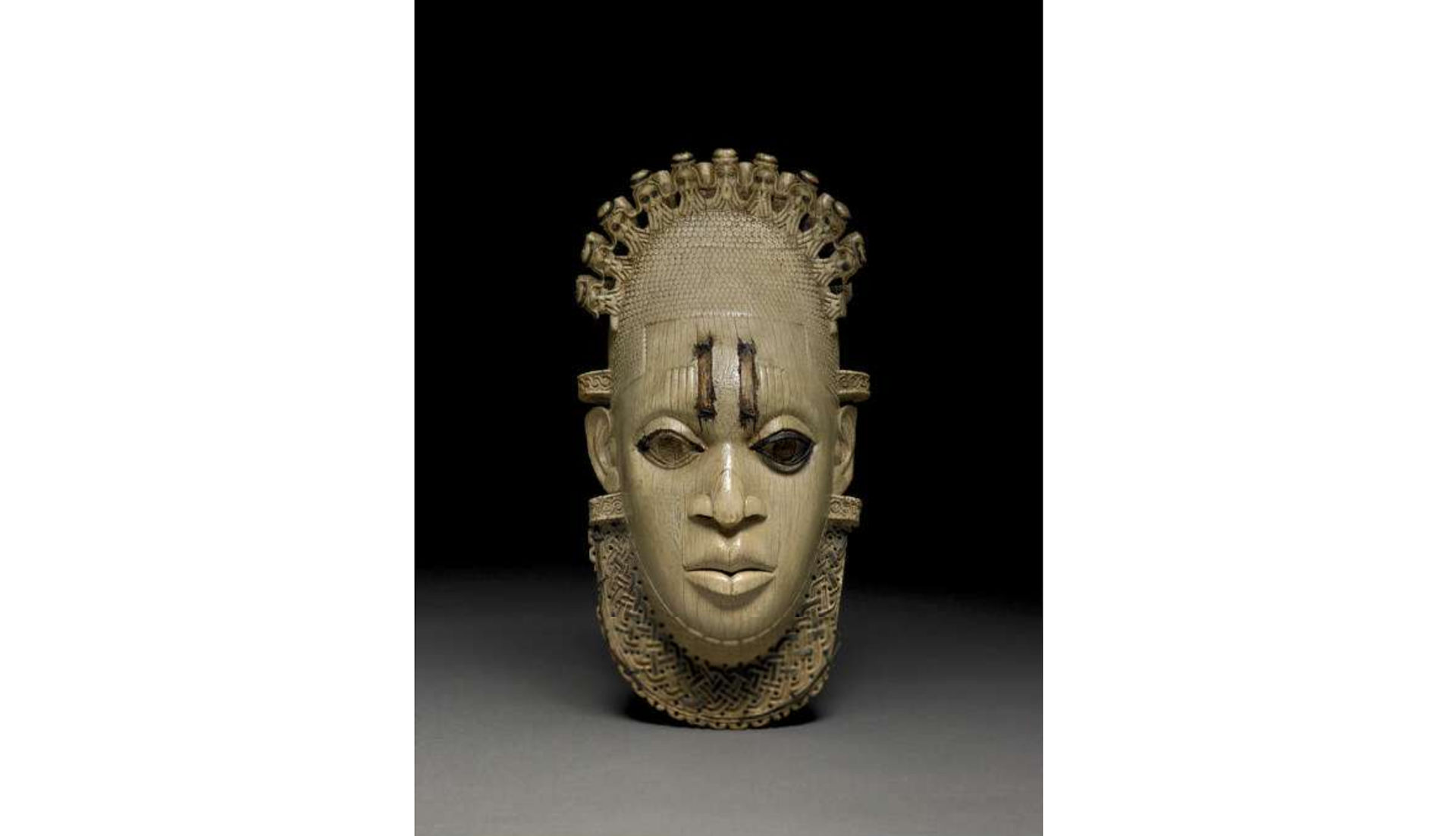 Pendant mask; regalia; carved from ivory - Image from the British Museum website