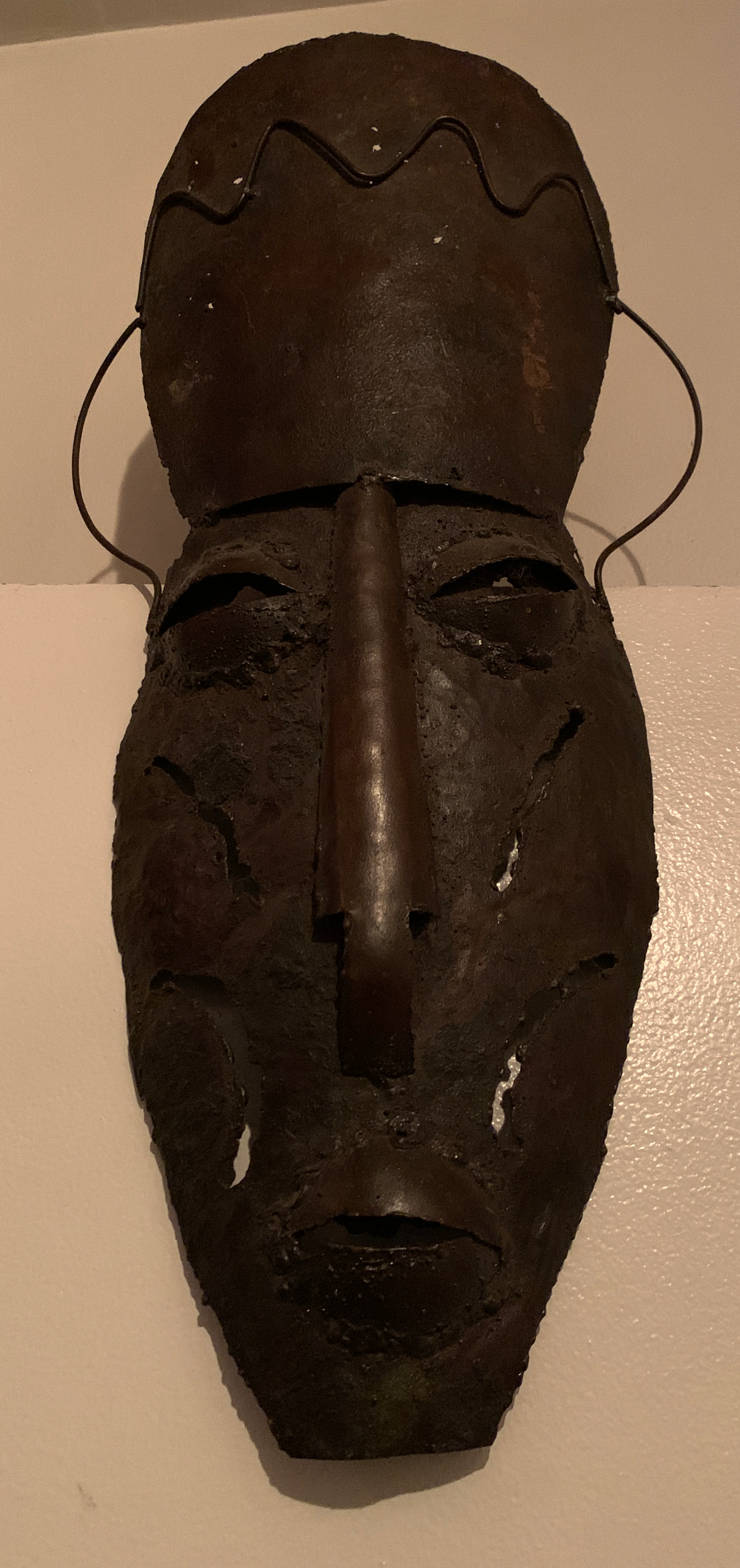 Zimbabwean contemporary metal mask - photography by Kholisile Dhliwayo (bought at Harare market)