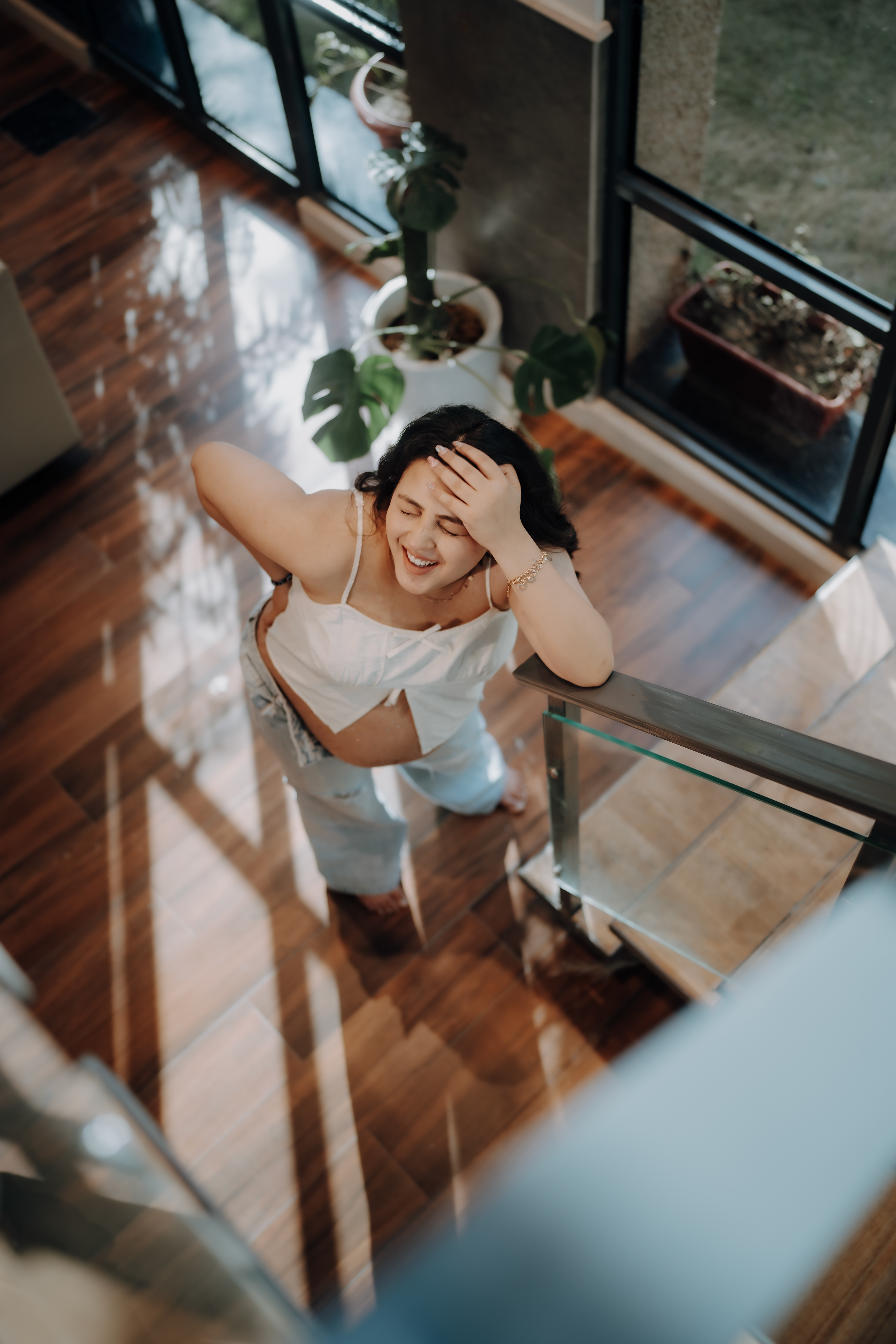 "Smiling through the journey of motherhood — a candid staircase shot that glows with joy."