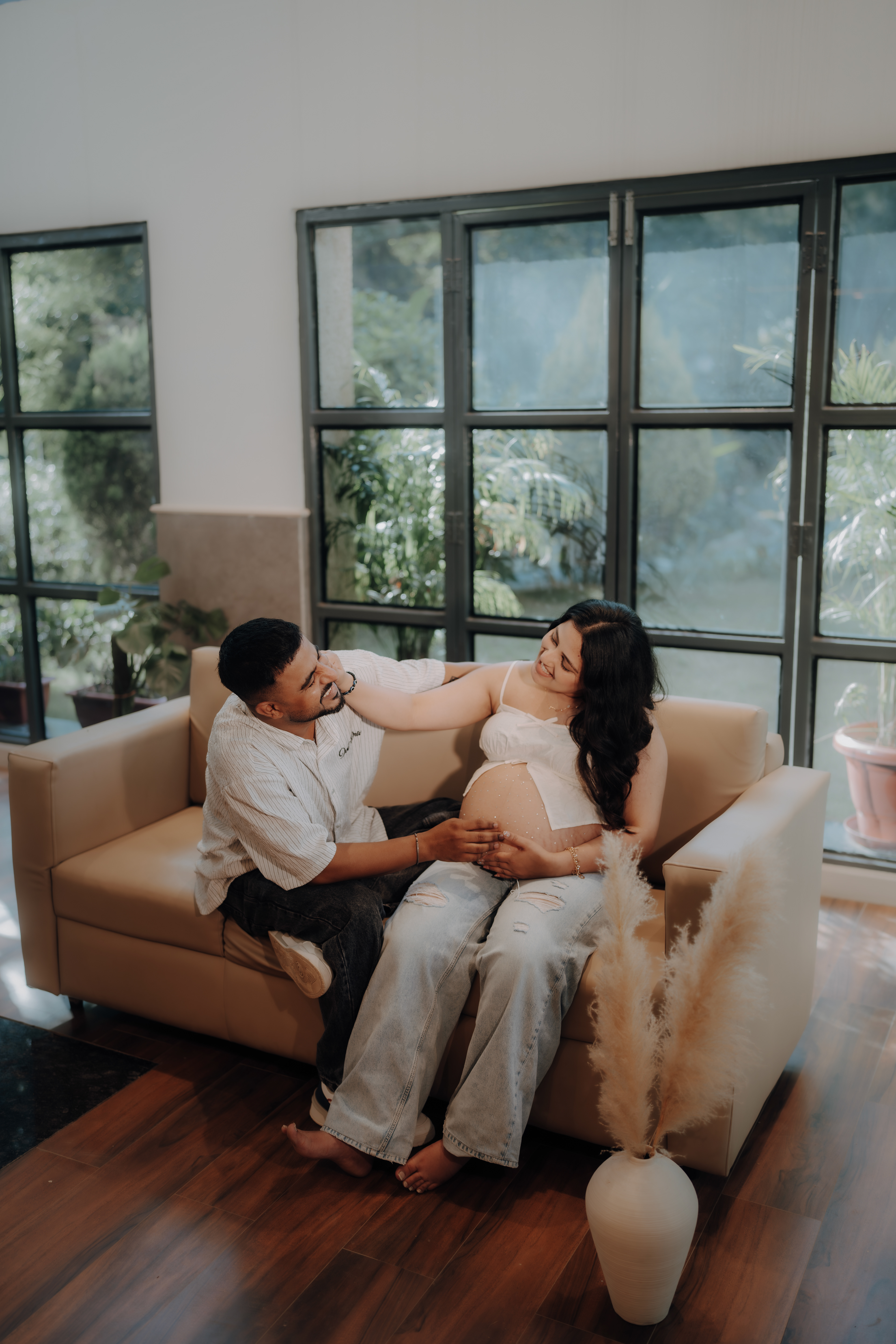 "Wrapped in warmth and waiting — a beautiful indoor maternity moment captured at Aqua Vista, Jammu by RP Films Jammu."