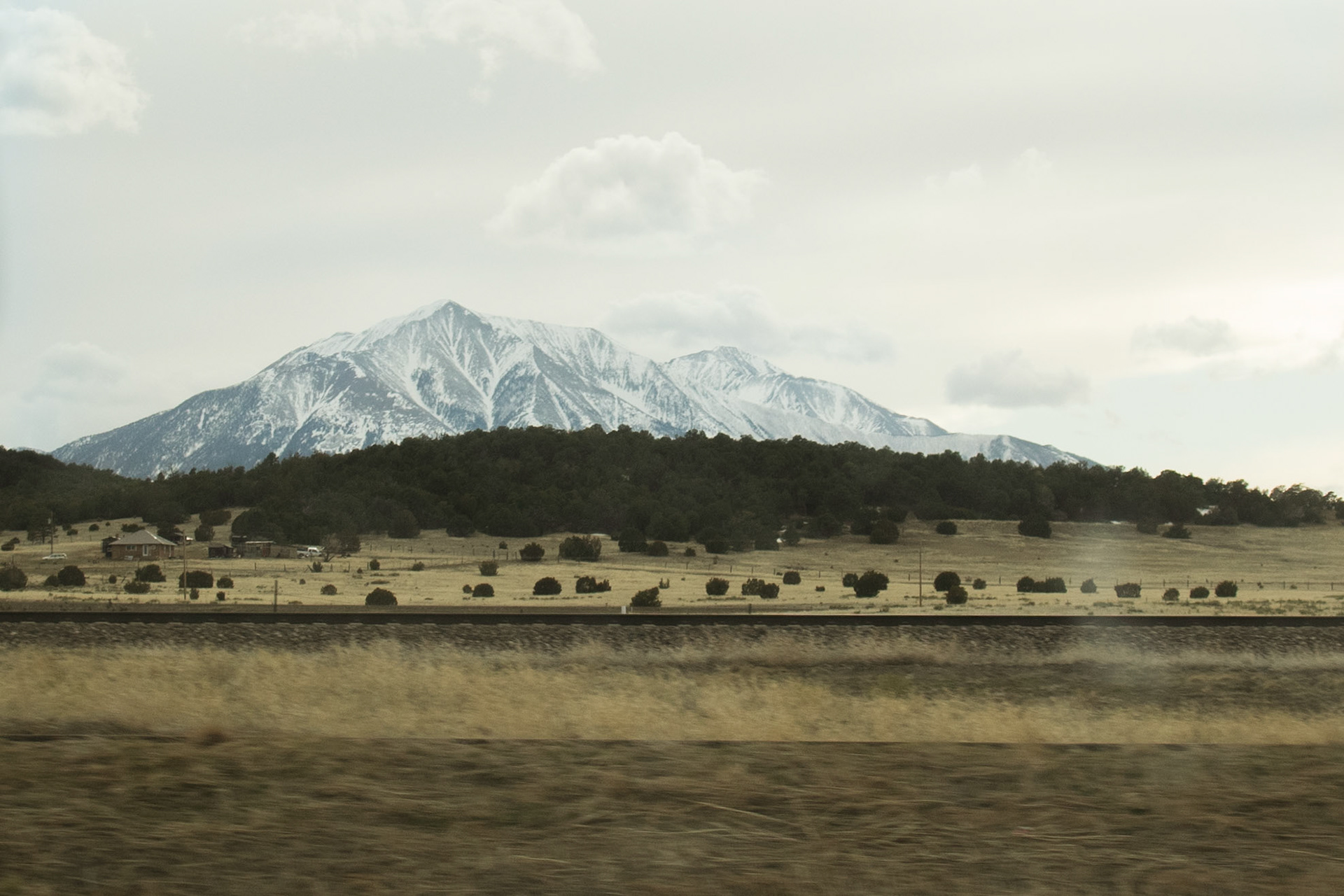 a mountain in colorado captured inside a moving vehicle