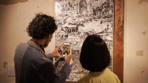 The viewer scanning the QR code