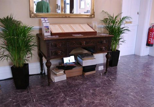 The installation was taking place underneath of a table