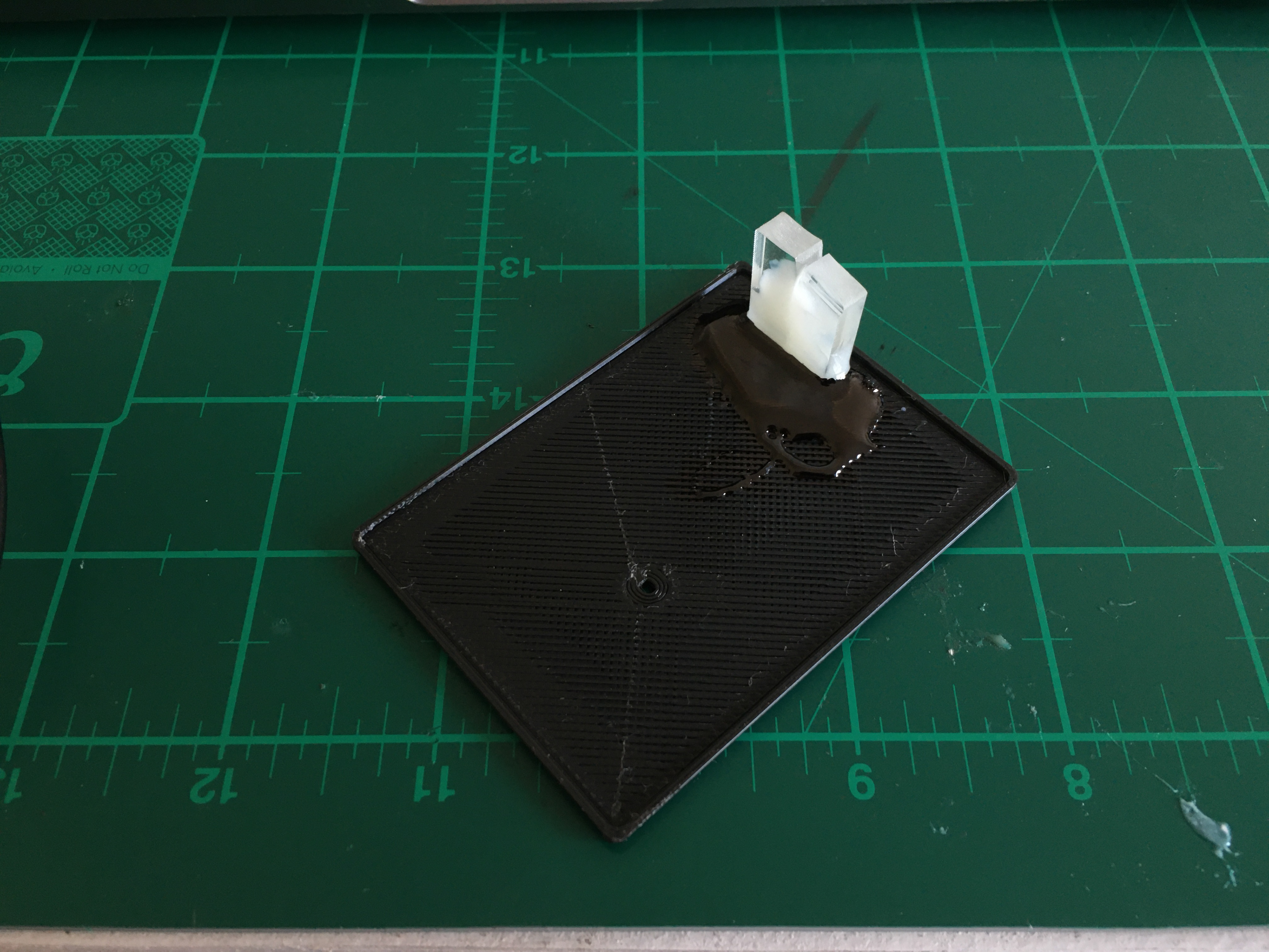 Two pieces of Perspex glued into the lid to transmit the "Charging" and "Done" LEDs to the outside world.