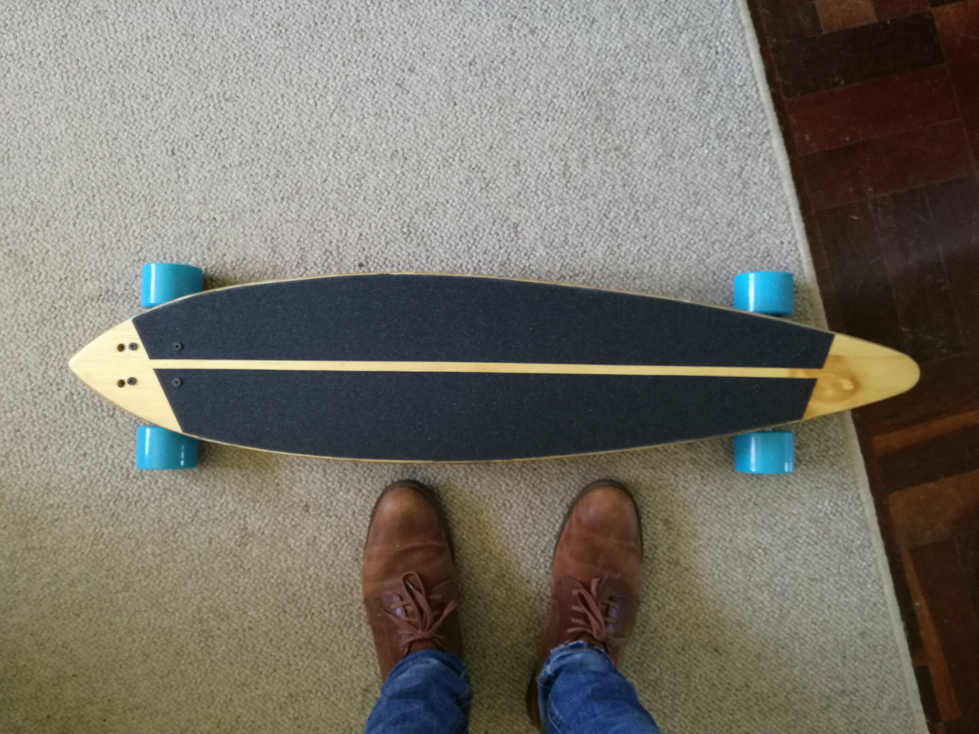 Grip tape cut and glued down; trucks added