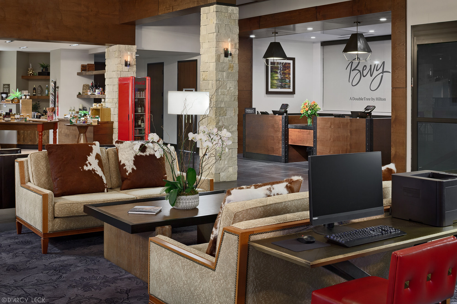 hotel photography of the lobby and front desk of The Bevy hotel