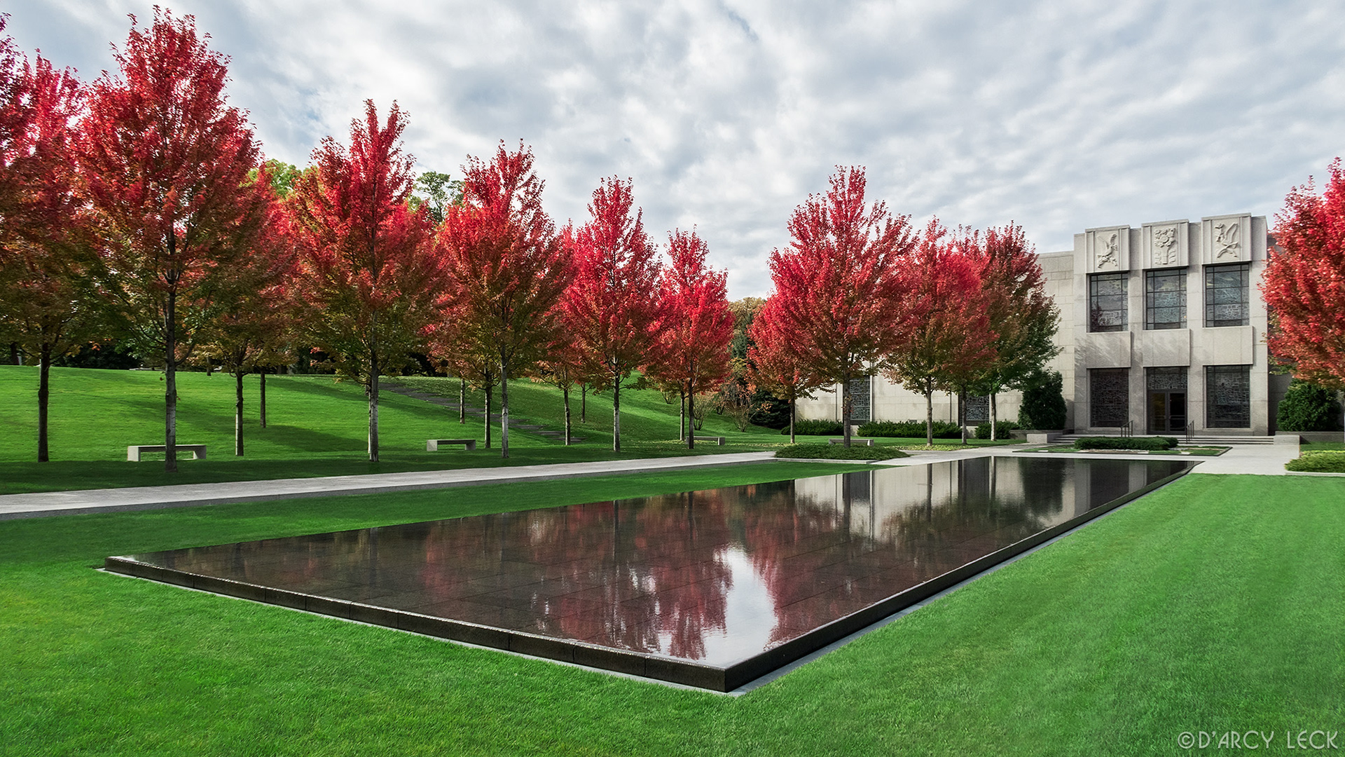 landscape architecture photographer D'Arcy Leck photographs the courtyard with autumn blaze maple trees and reflecting pond of the Lakewood Garden Mausoleum