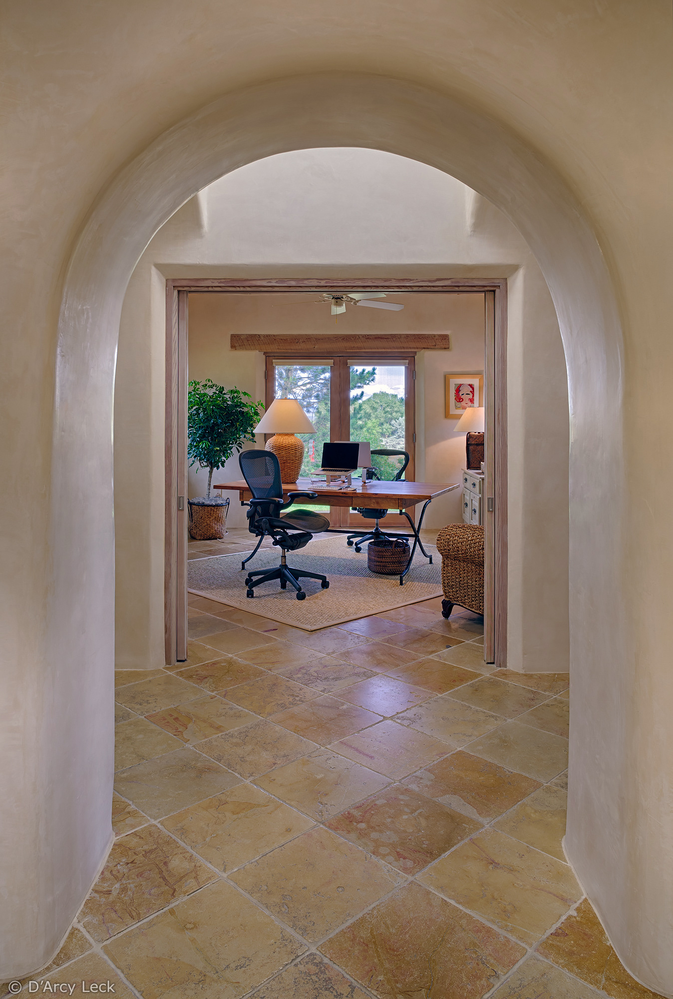 interior architectural photography of the arched hallway and home office of a luxury adobe home