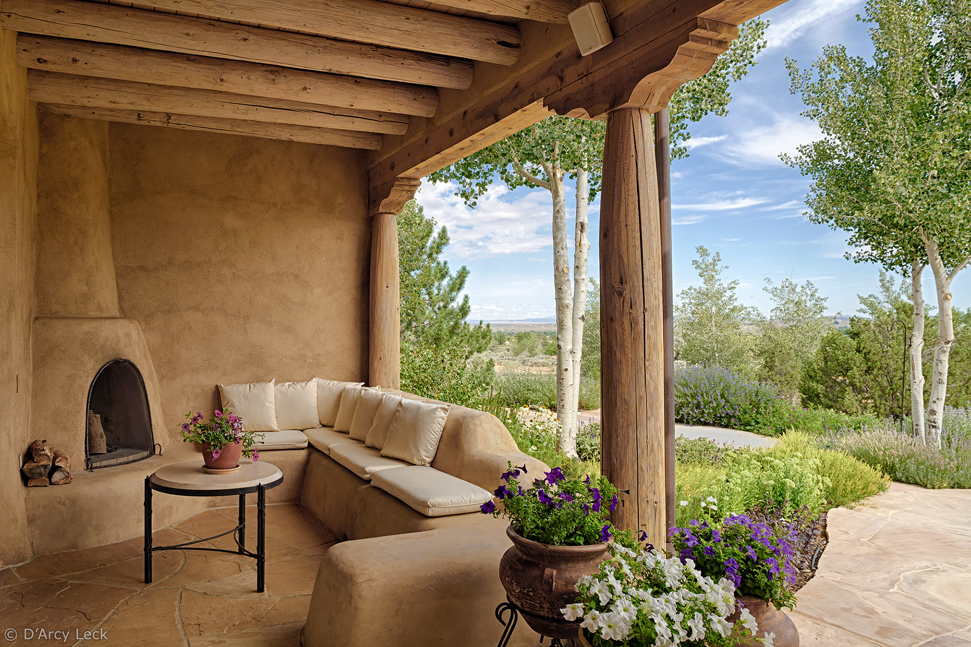 architectural photographer D'Arcy Leck captures the rear exterior porch of luxury adobe home in Taos