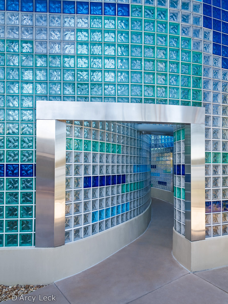 architectural photographer D'Arcy Leck captures the exterior entrance to the interior of colored glass block pool house