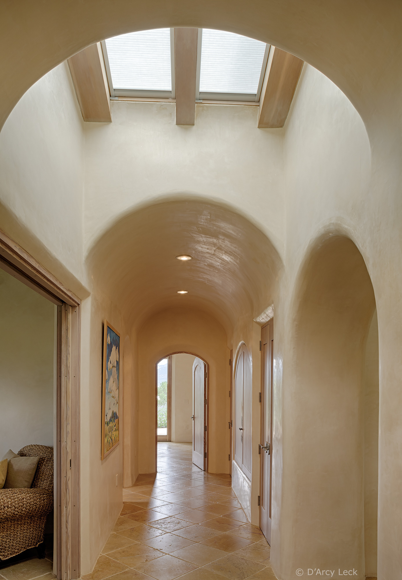 architectural photography of the arched hallway of a luxury adobe home