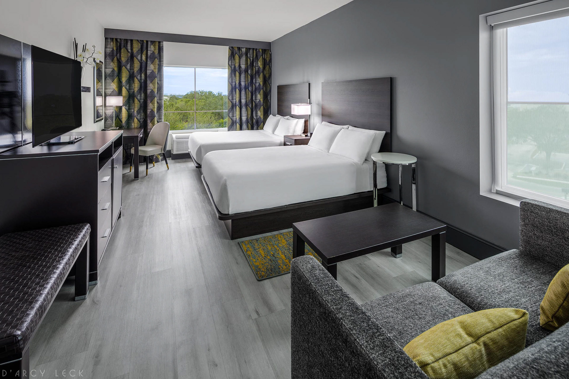 Hotel photographer D'Arcy Leck photographs a guest room at the DoubleTree by Hilton Denver Hotel