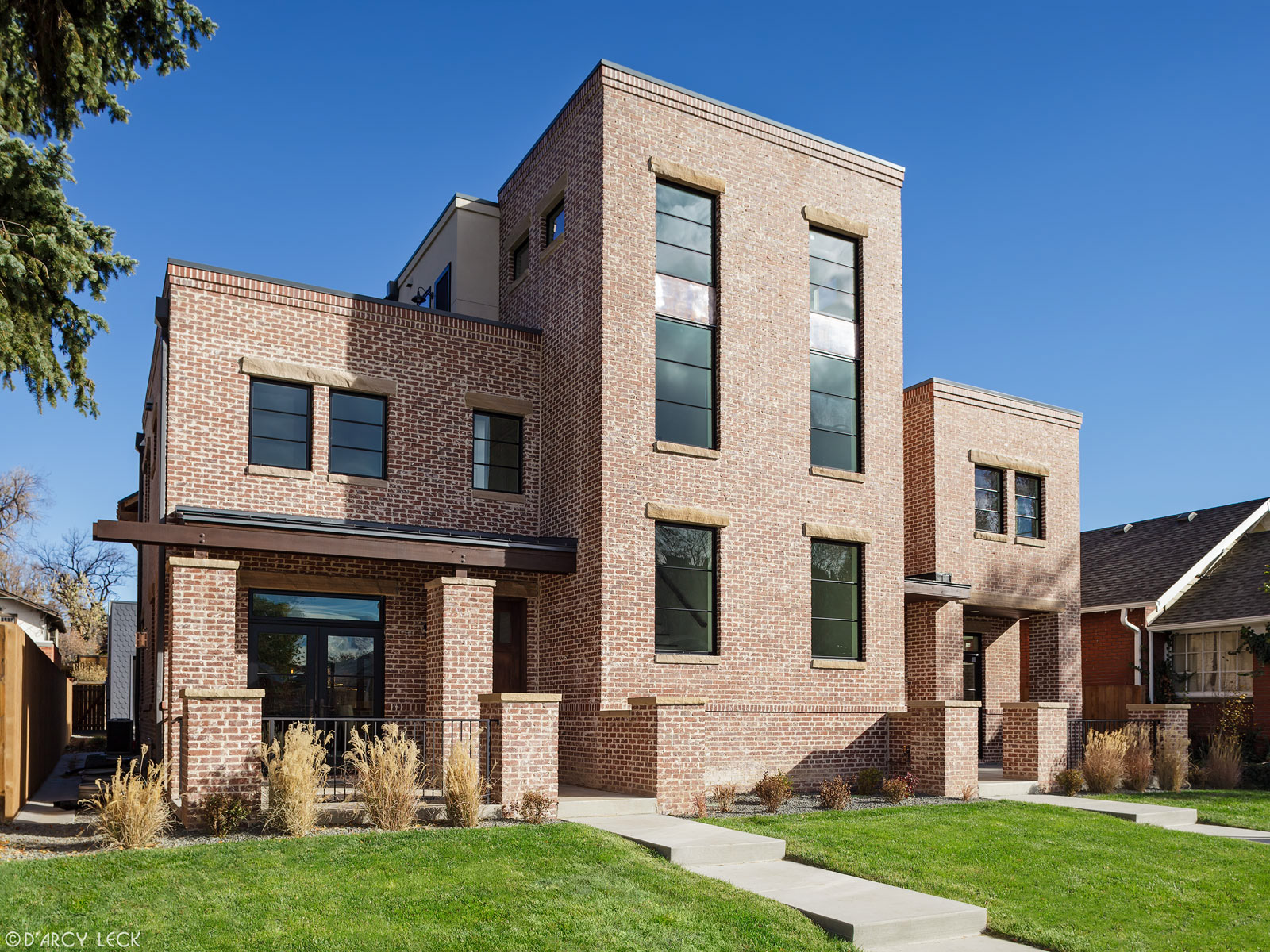 architectural photographer D'Arcy Leck photographs the exterior of an urban brick duplex for architecture firm MmD Architecture Studio