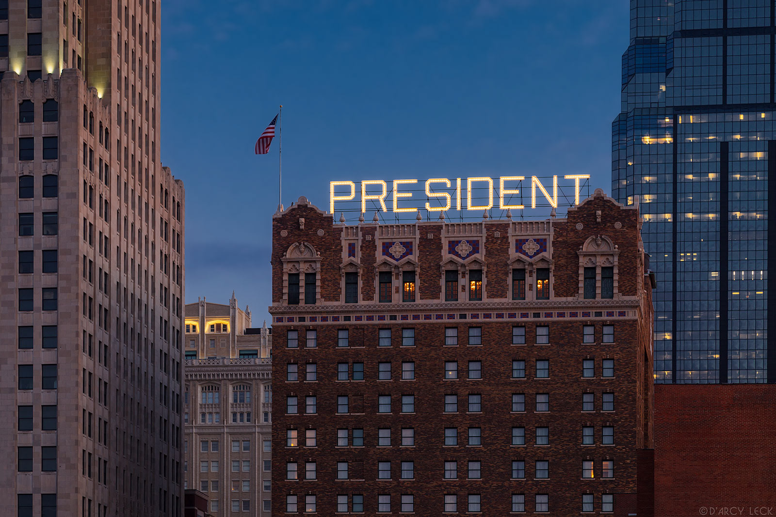 Hotel photography of Hilton President Kansas City hotel exterior sign at dawn