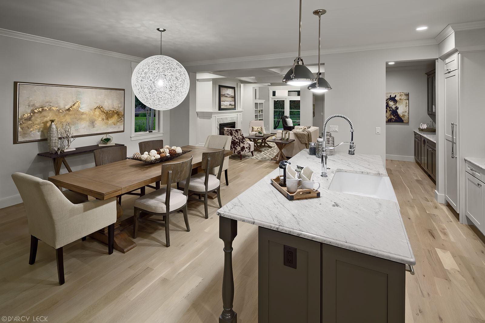 interior architectural photography of the main floor kitchen, dining room, and living room of a modern duplex