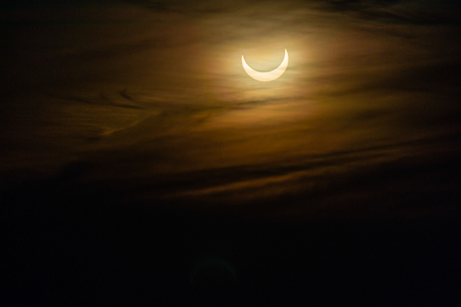 Under a dark sunrise