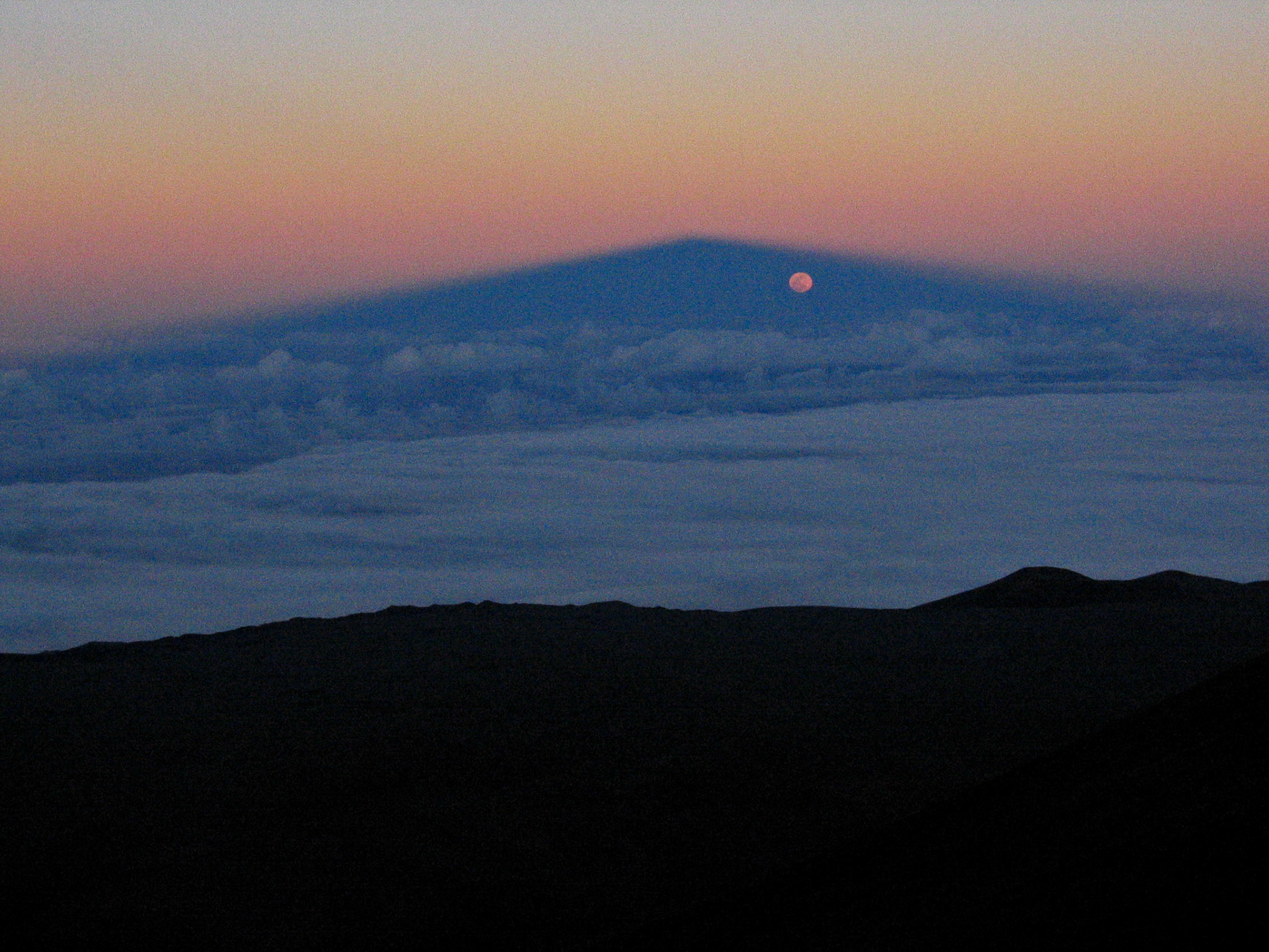 Brockenspectre and rising moon, Mauna Kea