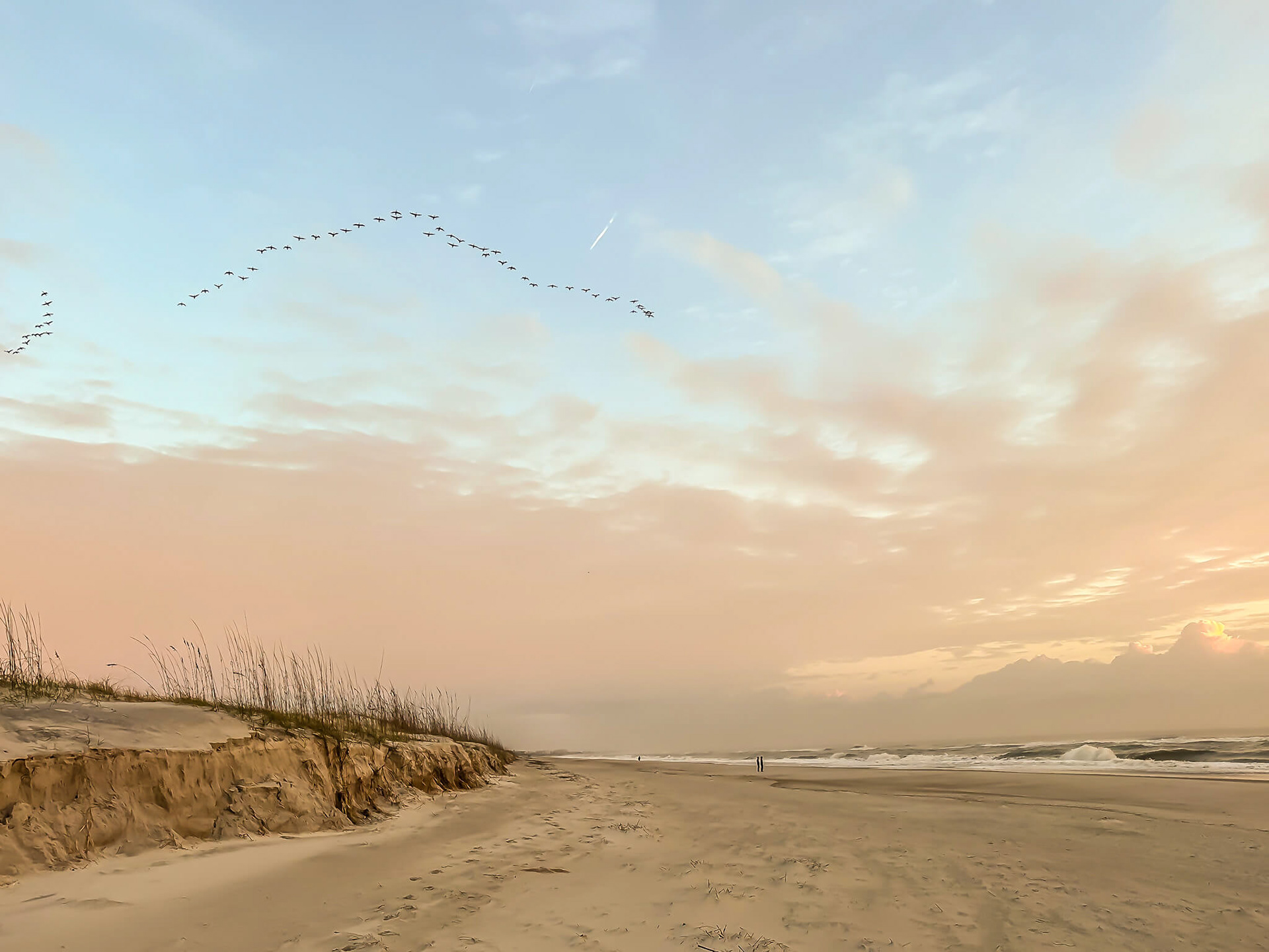 The beach is long and flat.