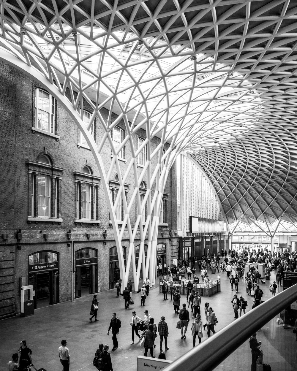 The visually striking vaulted, semi-circular Western Concourse, Kings Cross Station. Image © Nik van Herpt