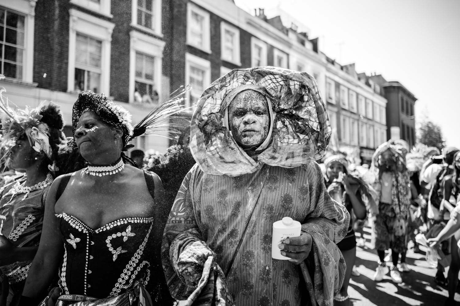 Carnival performer with white face powder. Image © Nik van Herpt