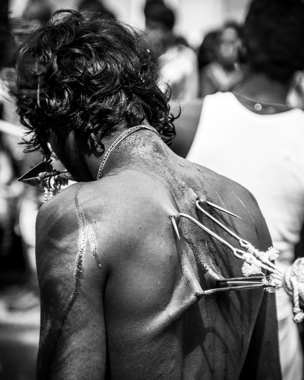 Man, with hooks in his back at the 2011 Hindu Chariot Festival in West Ealing. Image © Nik van Herpt