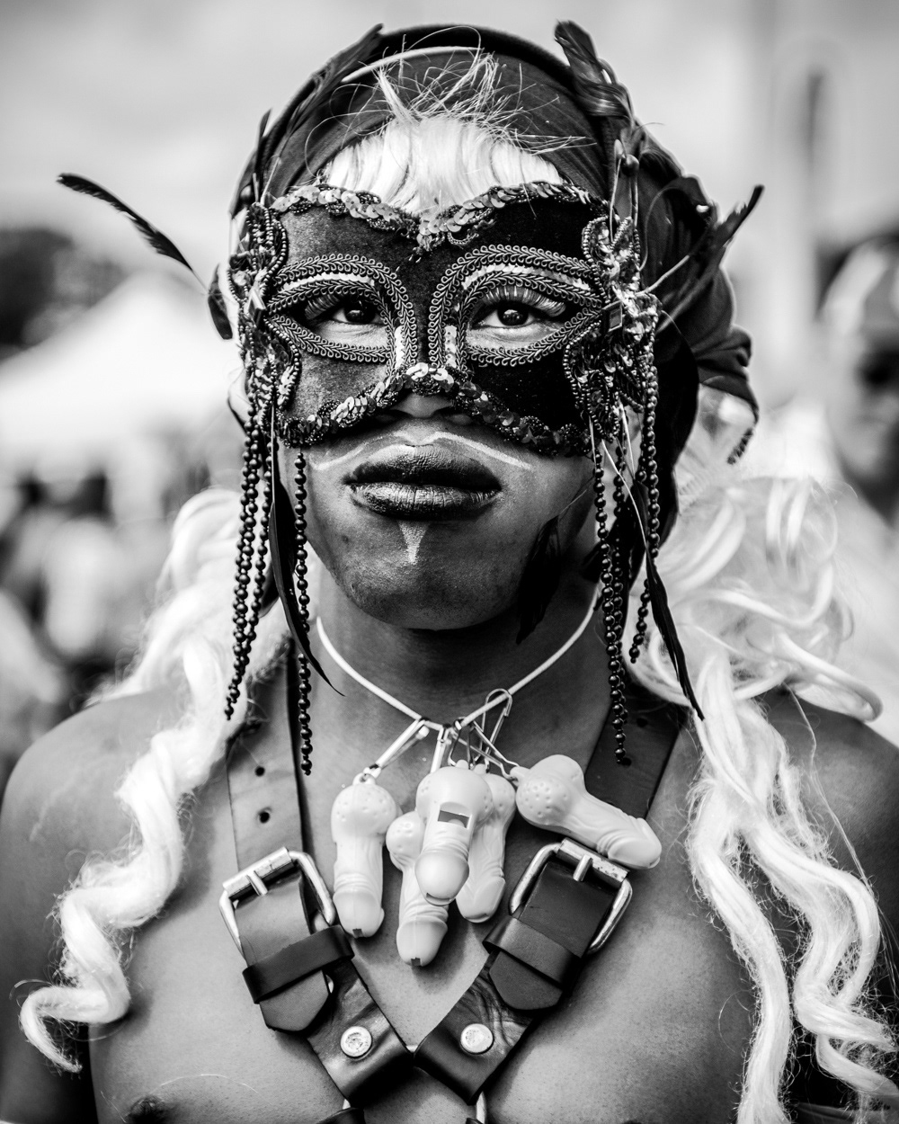 Man wearing an eye mask and whistles around his neck. Image © Nik van Herpt