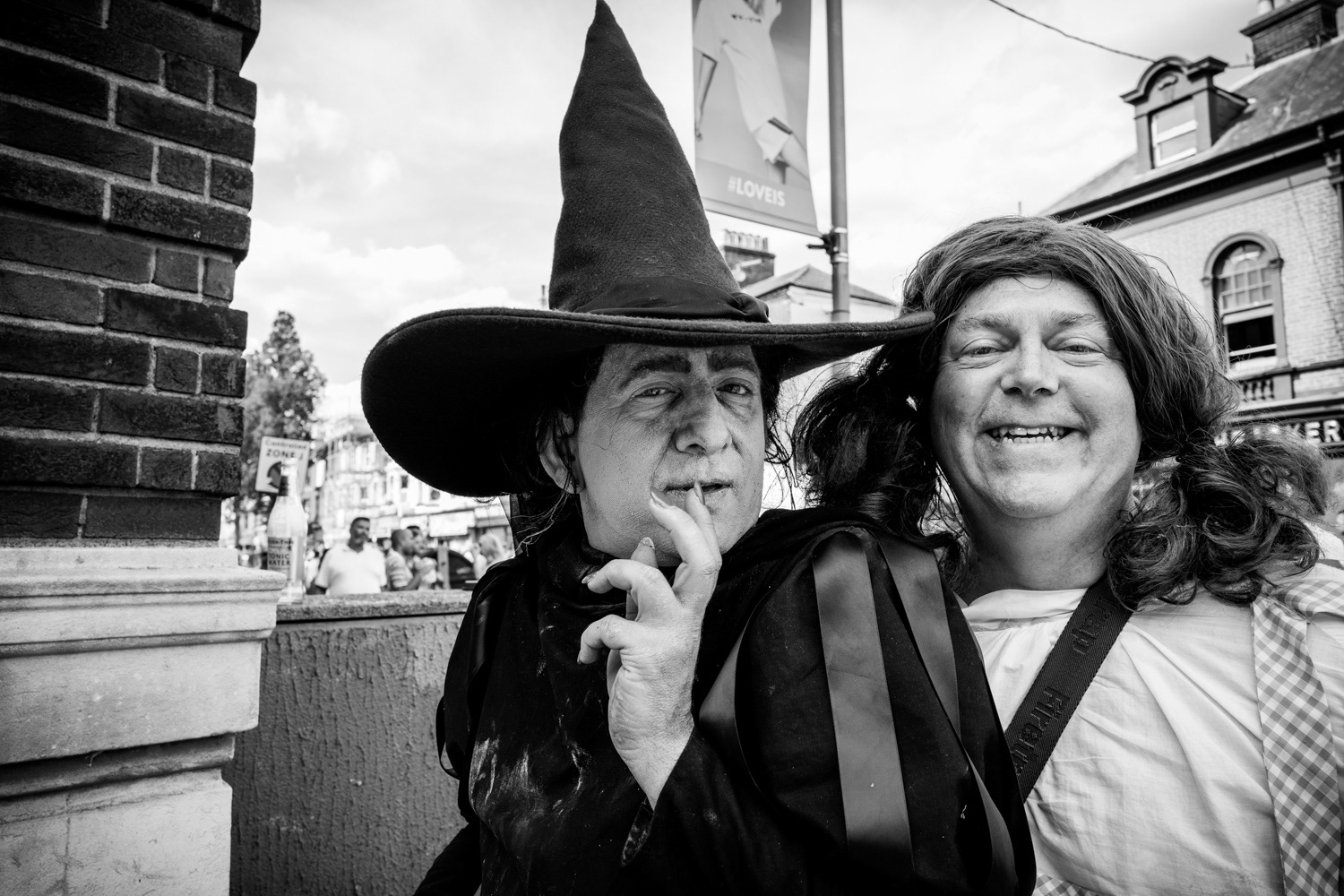 Two men, one dressed as a witch, the other as a girl. Image © Nik van Herpt