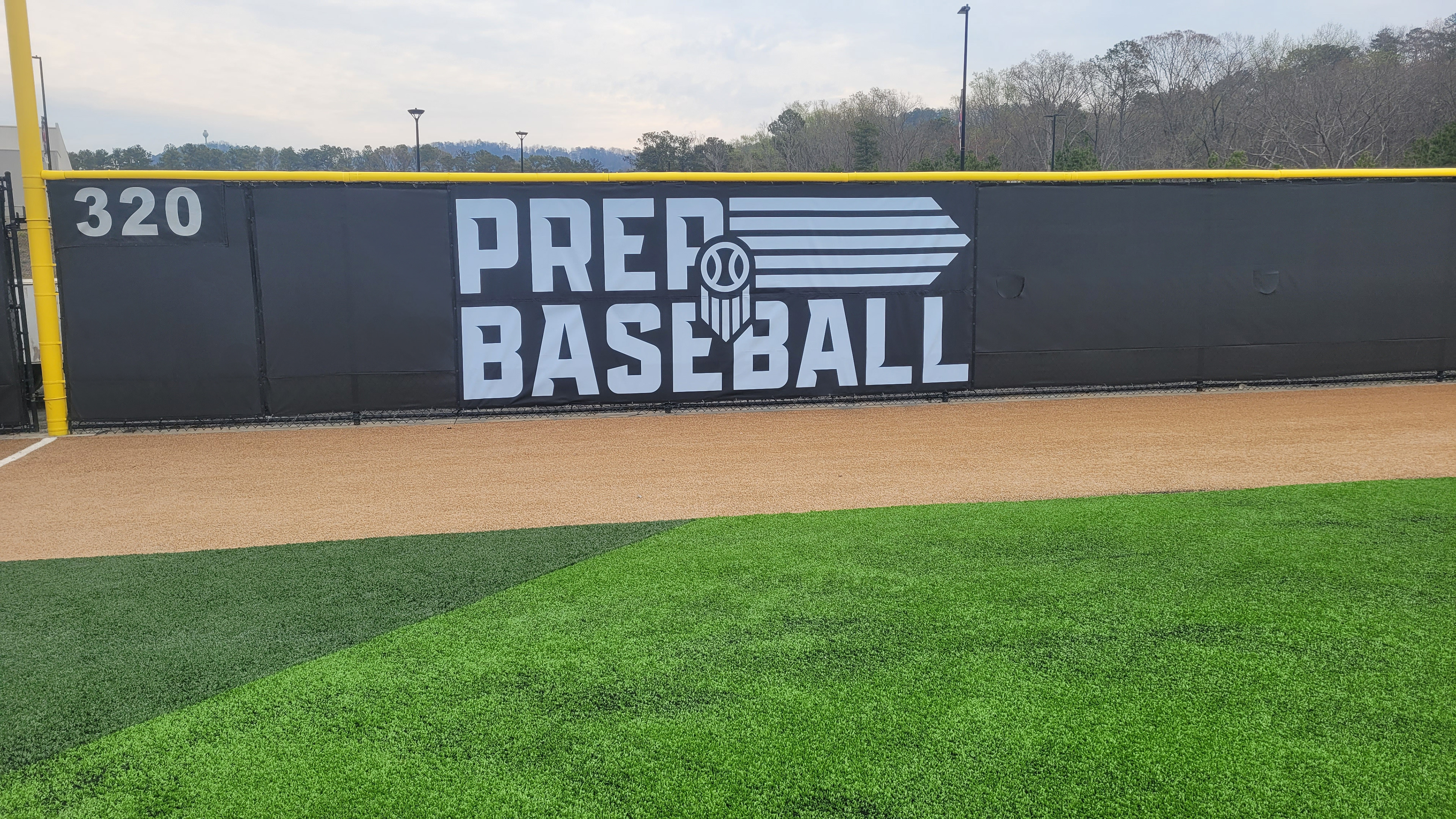 black fence windscreen printed with white logo and lettering, Yellow fence cap topper