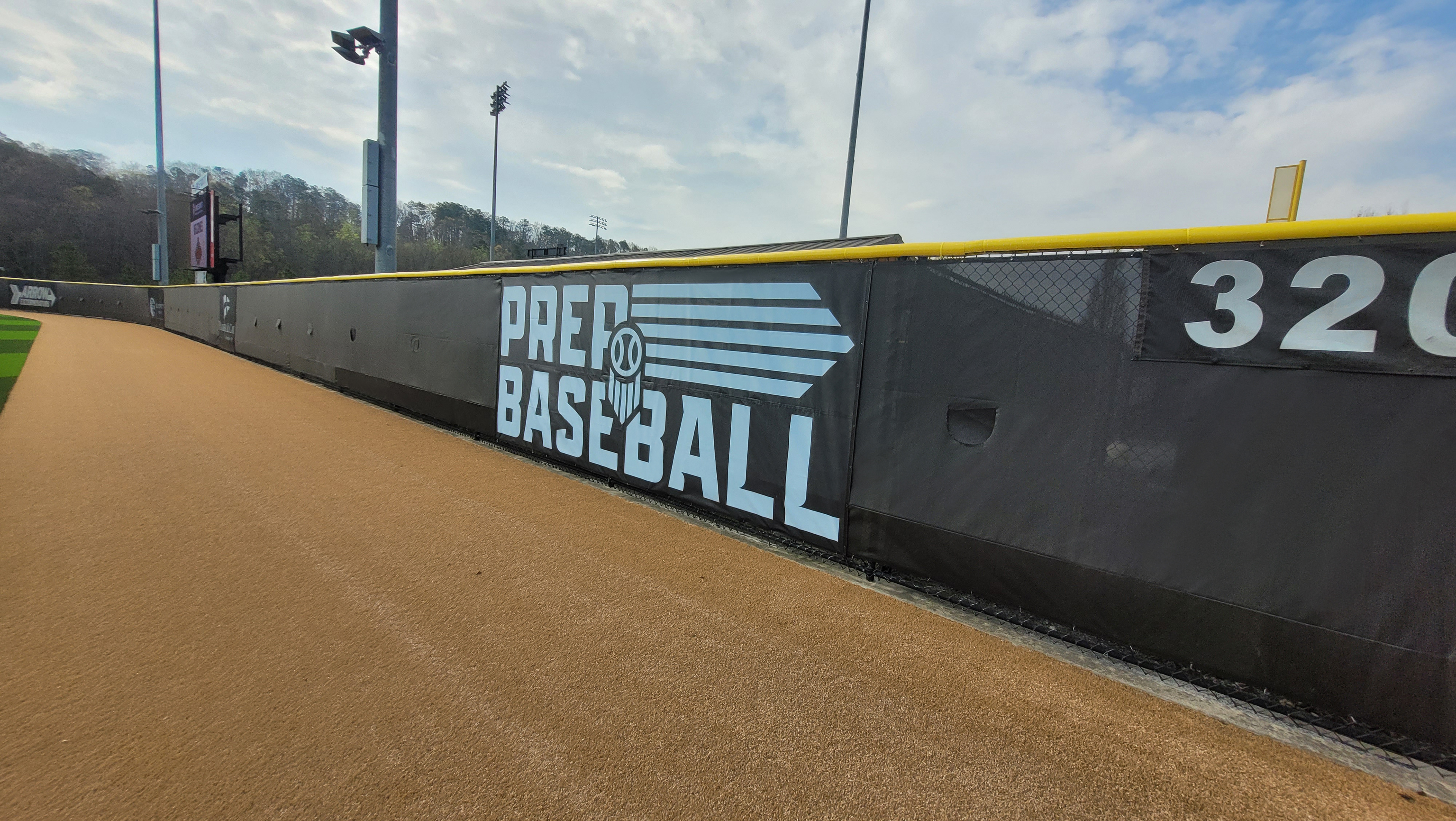 black fence windscreen printed with white logo and lettering, Yellow fence cap topper