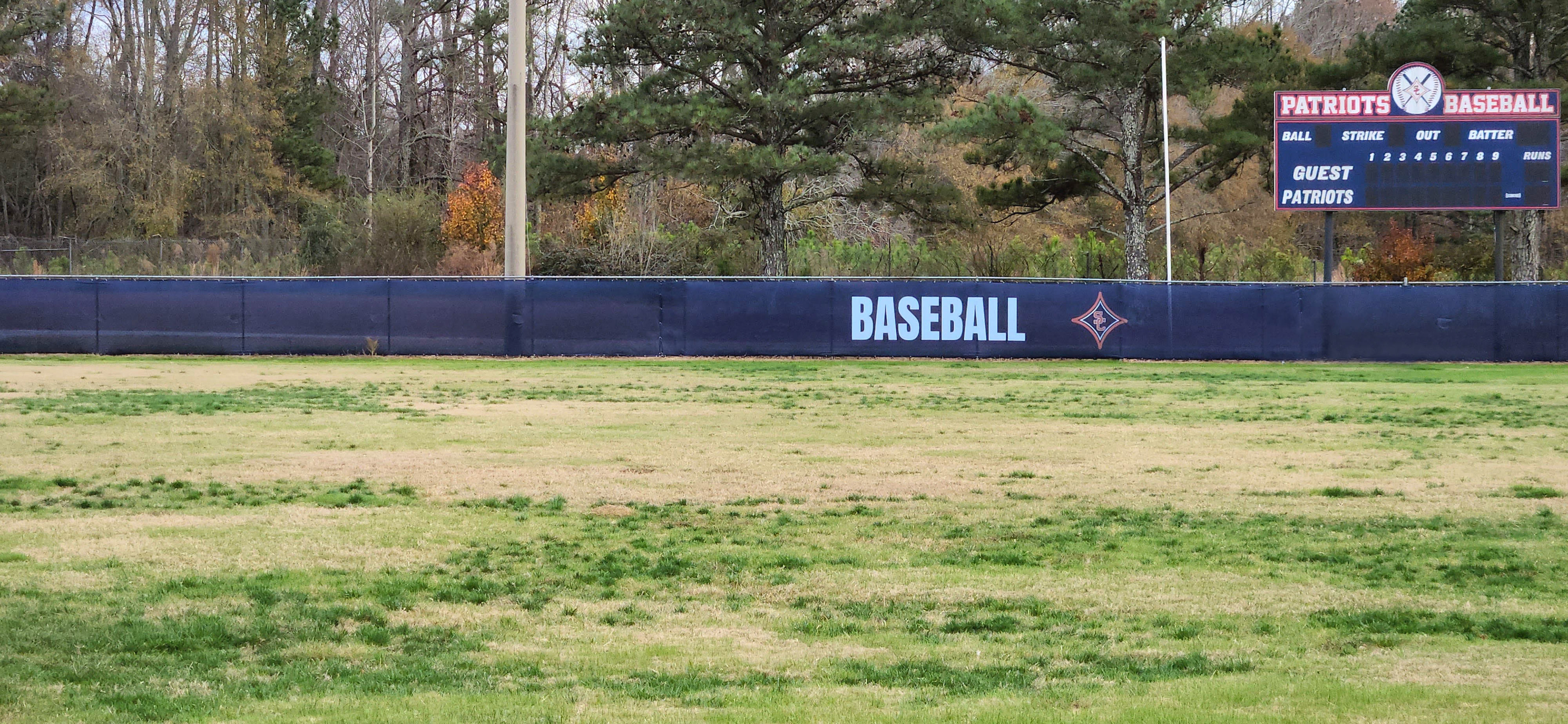 Navy blue fence windscreen featuring a small red SC logo at the center of a red four-point star with a white outline, positioned to the right of the word 'Baseball' printed in white ink.