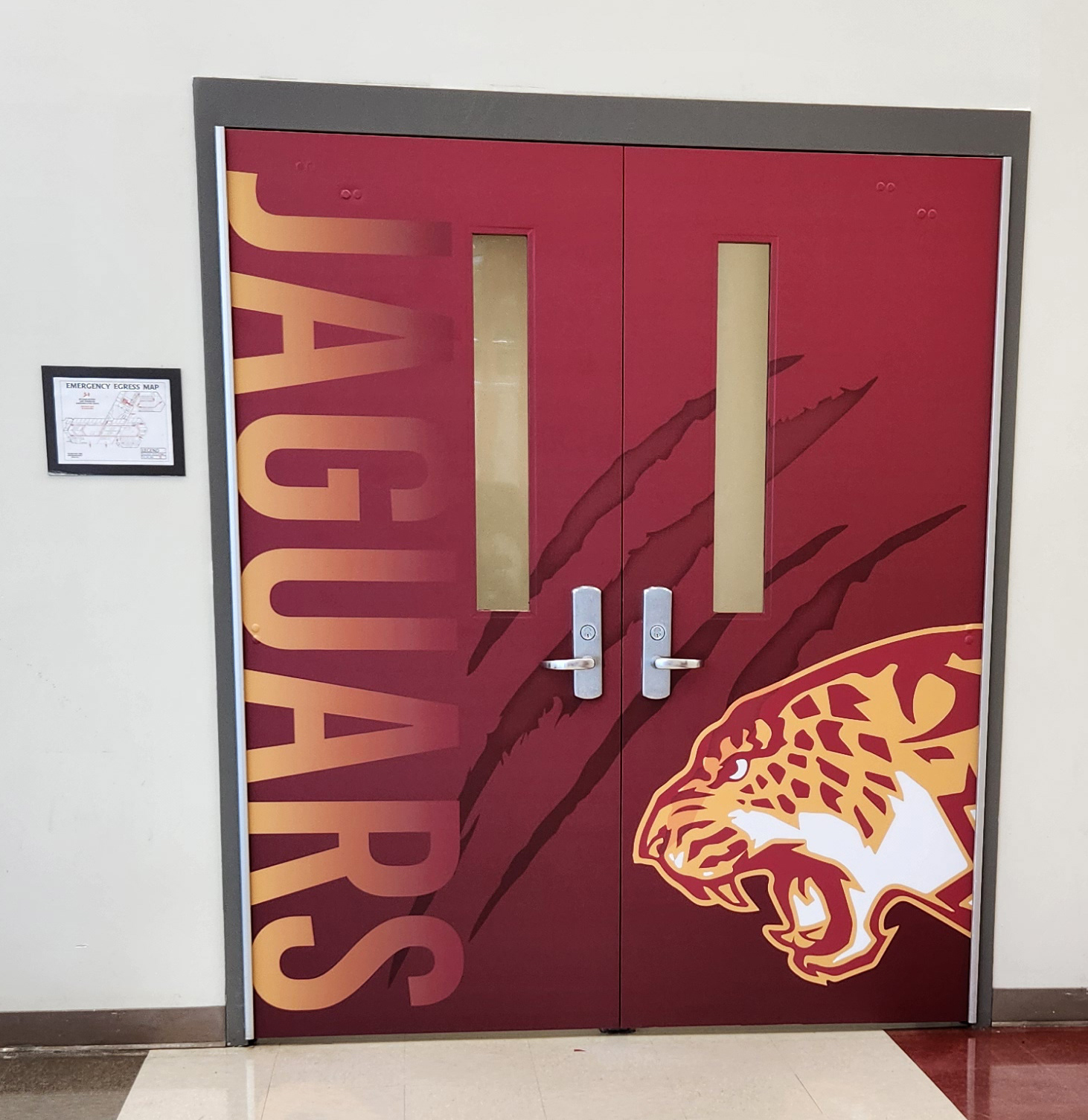 This full-color adhesive vinyl door wrap boldly showcases the "JAGUARS" message.