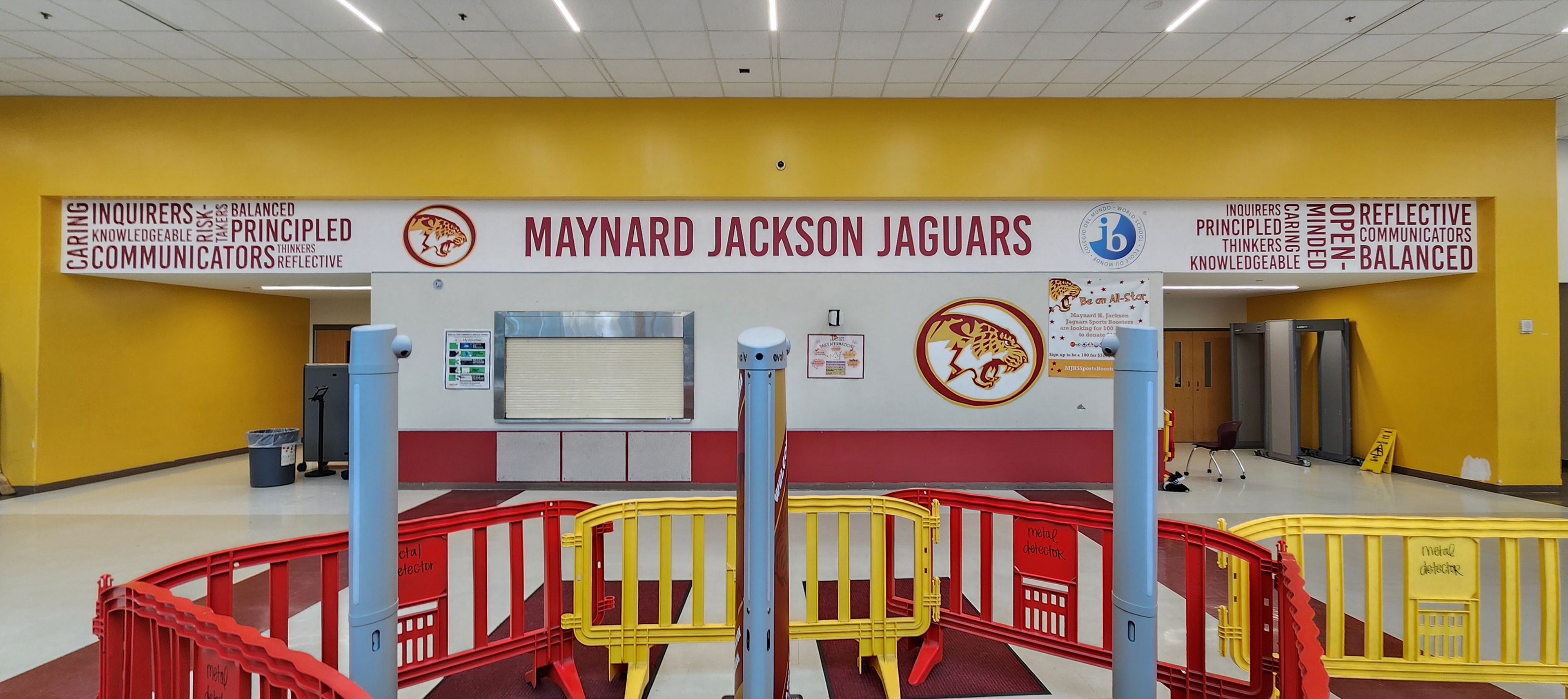 Full color print adhesive vinyl lettering reading "MAYNARD JACKSON JAGUARS", various inspirational words, two jaguar logos and one ib logo.