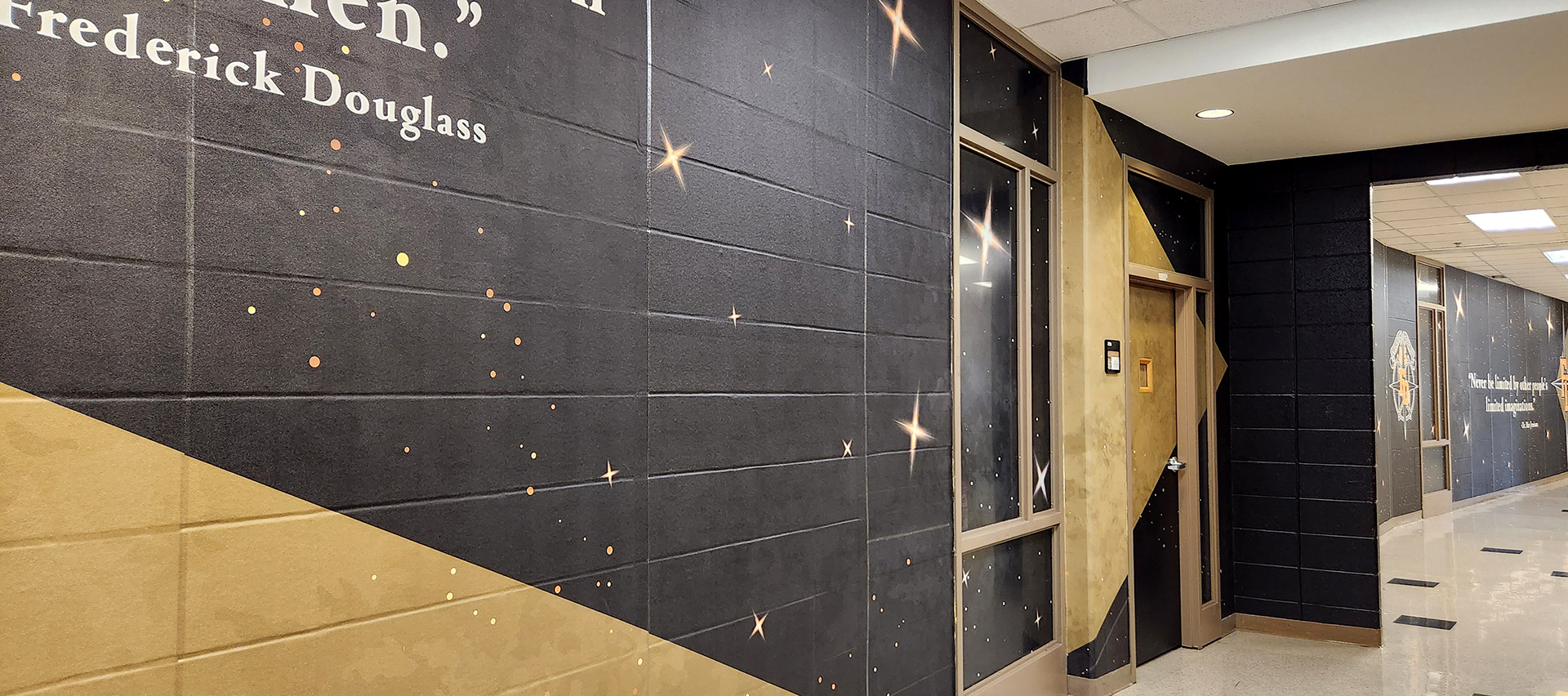full print adhesive vinyl wall mural and window perf printed with gradient white and yellow stars on an all black background