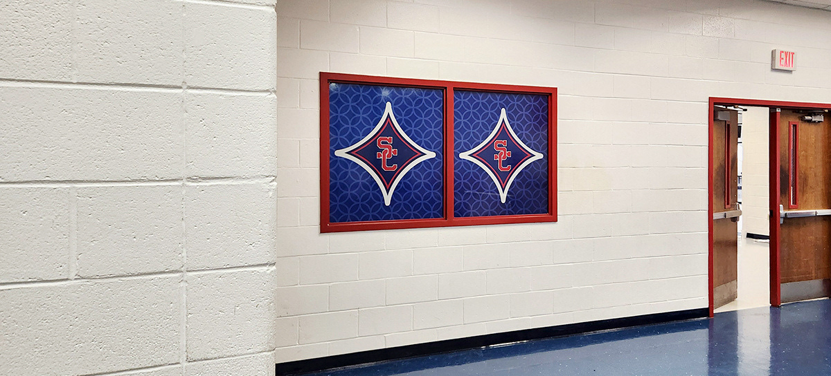 A full print red, white, and blue window perforation branded with a SC logo