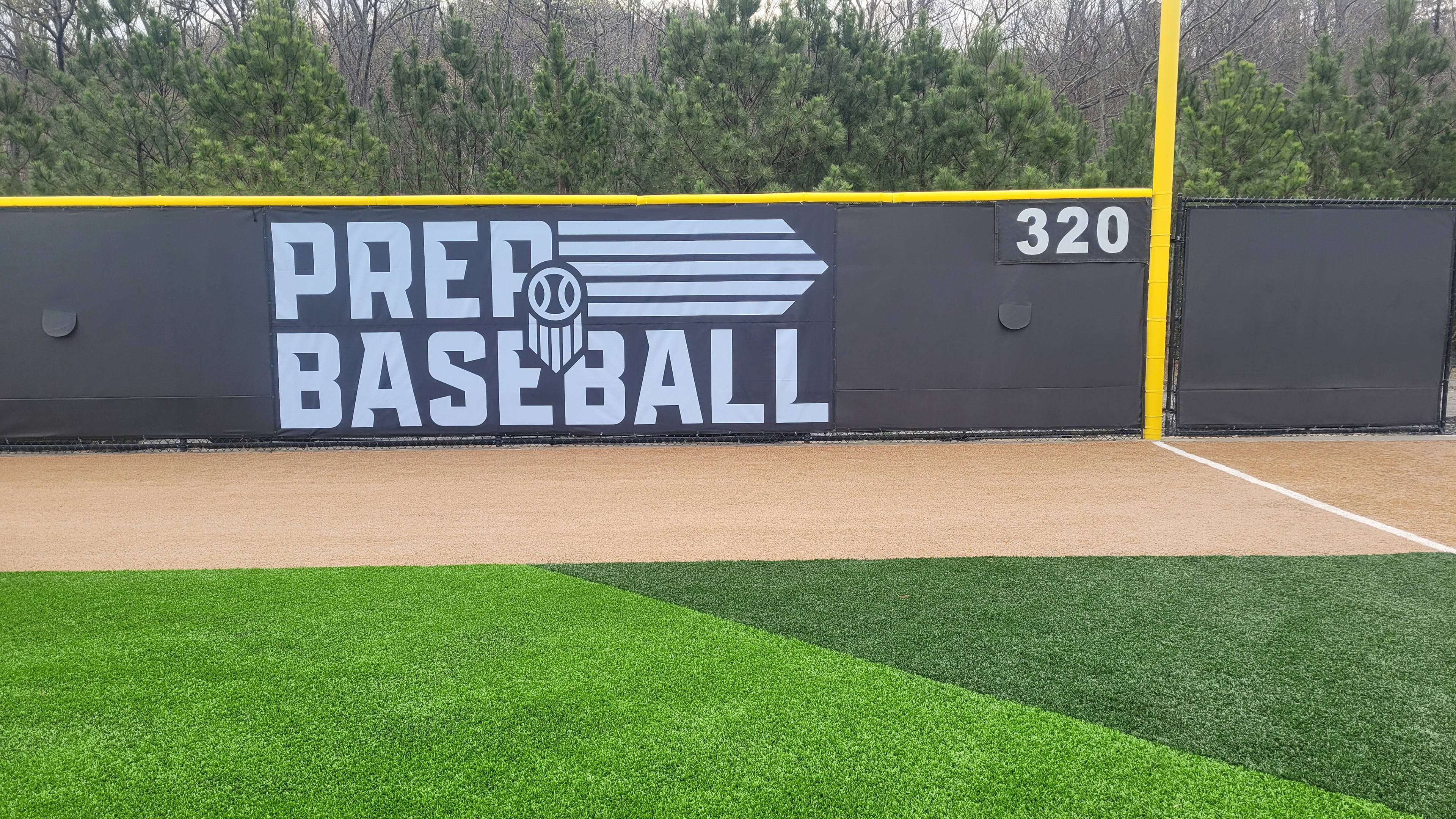 black fence windscreen printed with white logo and lettering, Yellow fence cap topper