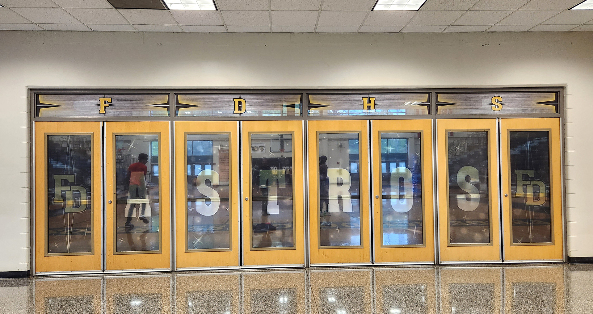 window perf over eight doors reading 'FDHS' in yellow with a grey background. On the doors window perf reading 'FD Astros FD' in yellow on a grey background