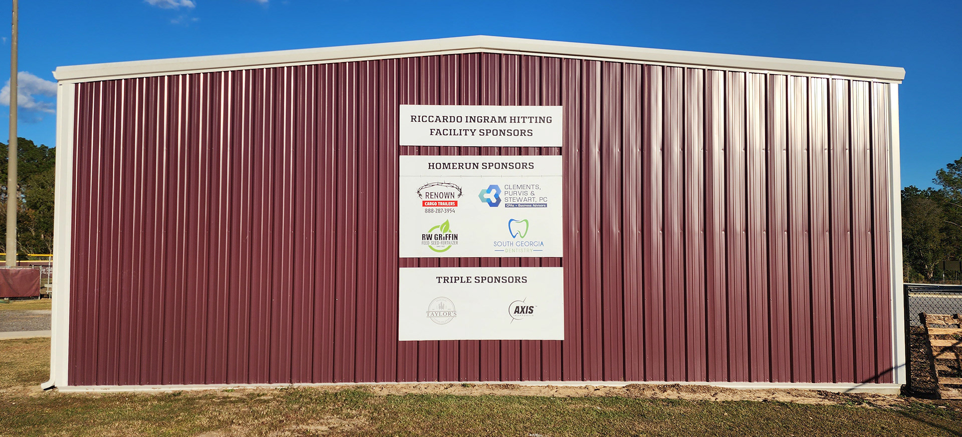 Sponsor signage displayed on the side of Coffee High School's Riccardo Ingram hitting facility.